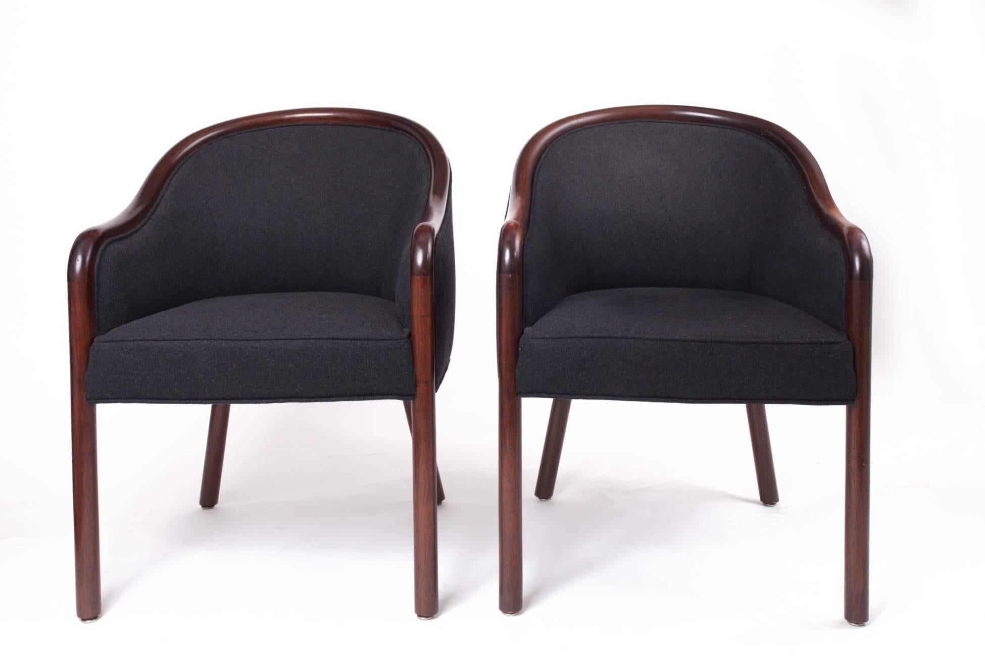 Ward Bennett (1917–2003)

A graceful and welcoming pair of club armchairs by Ward Bennett for Brickel Associates, with sinuous Bauhaus-influenced arms, a plush seat, and flared rounded back legs offset by straight rounded front legs. In a rich, dark