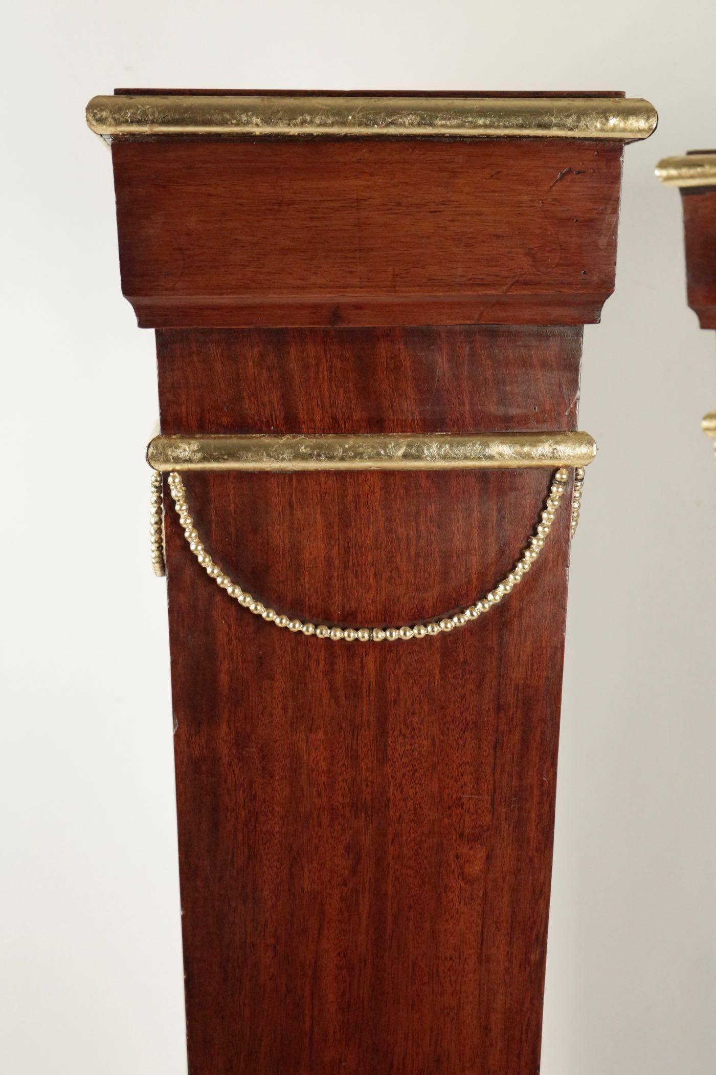 Pair of sheaths, consoles, mahogany, gold leaf, 19th century, Napoleon-III. Measures: H 101 cm, L 28 cm, P 22 cm.