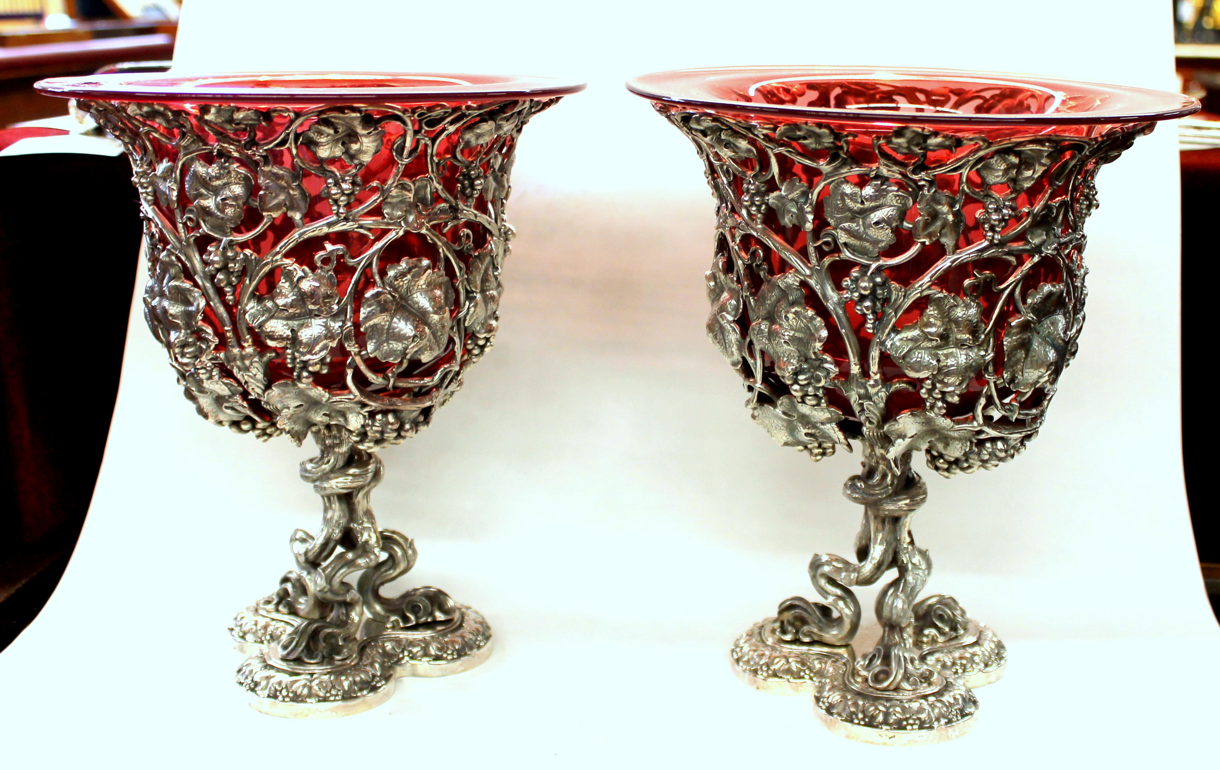 Pair of magnificent quality old reproduction Sheffield silver plate Rococo style wine coolers with original mouth blown cranberry crystal liners. Please note the exceptional 