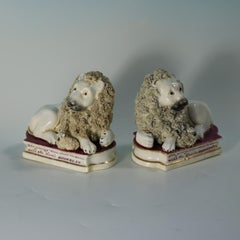 Pair of Shelton Staffordshire Lion and Lamb figures