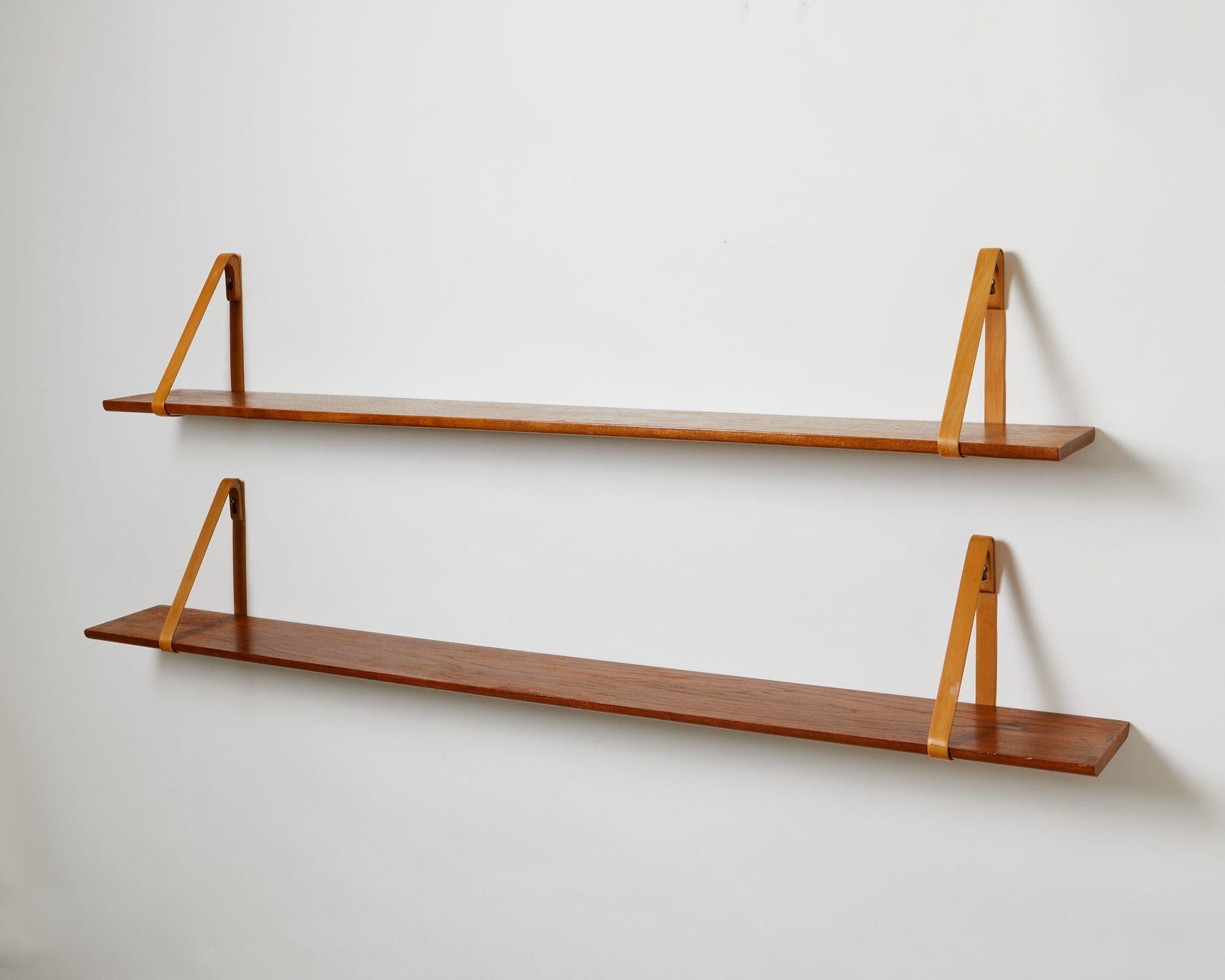 Solid teak and mahogany. Beech wall mountings.

Manufactured by I. Christiansen.

Measures: L (1) 140 cm/ 4' 7