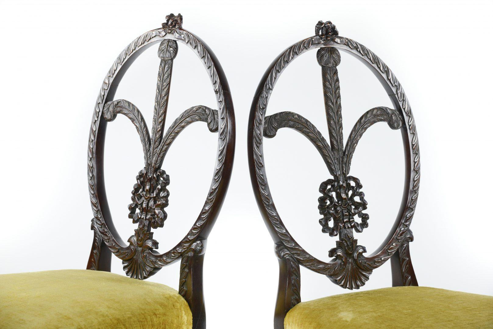A pair of mahogany Sheraton style children’s chairs each with carved Prince of Wales feather backs.
Highly unusual delicate fine quality pair of chairs made for a fine house in the Sheraton style.