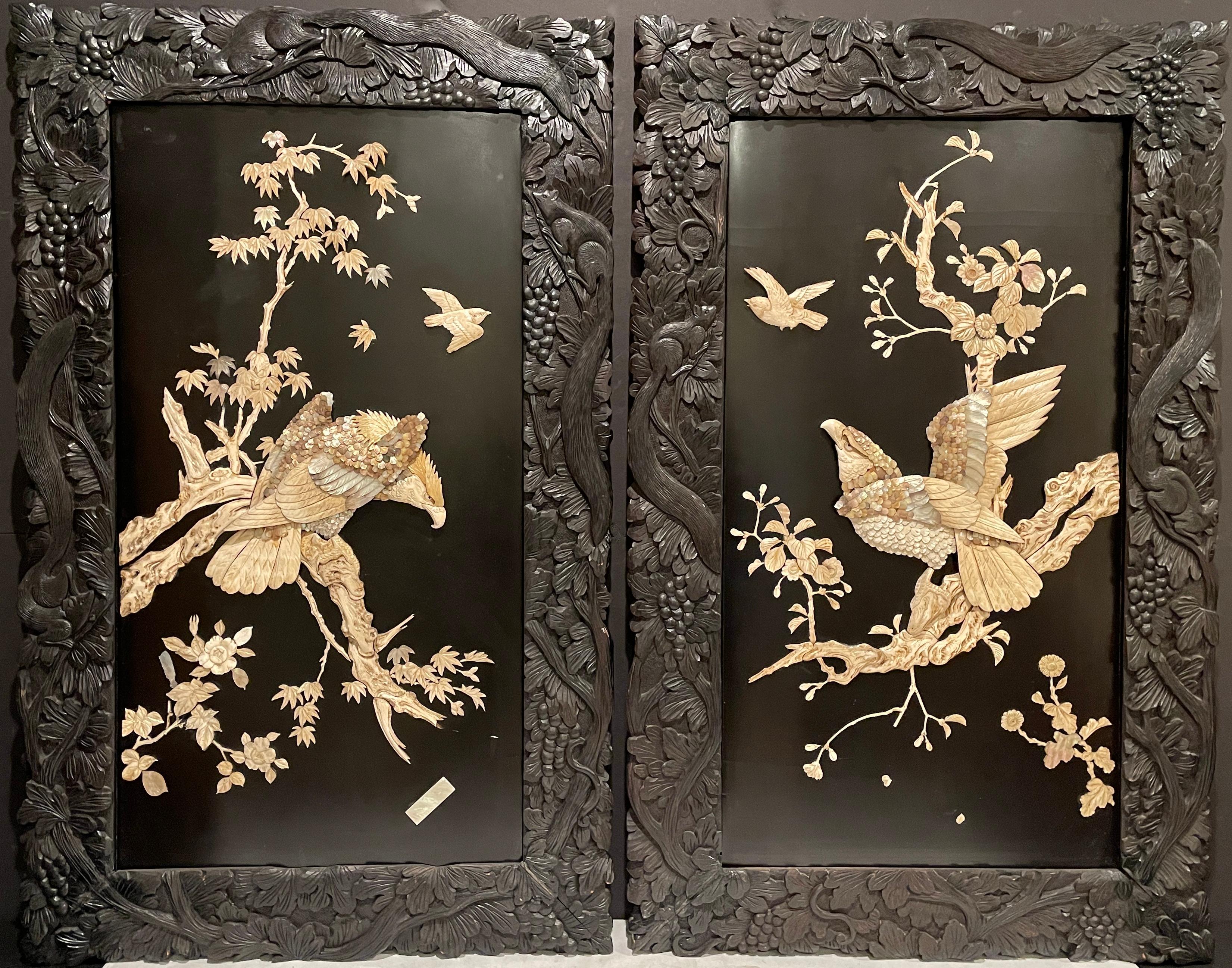 A pair of finest quality Meiji period Japanese carved, inlaid and lacquered hanging panels. Beautifully framed with original carved wood frame featuring squirrels climbing through leaves and branches. Panels featuring layered bone and mother