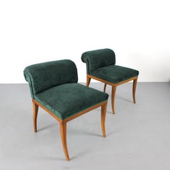 Pair of shoe racks with a root wood frame and green chenille upholstery