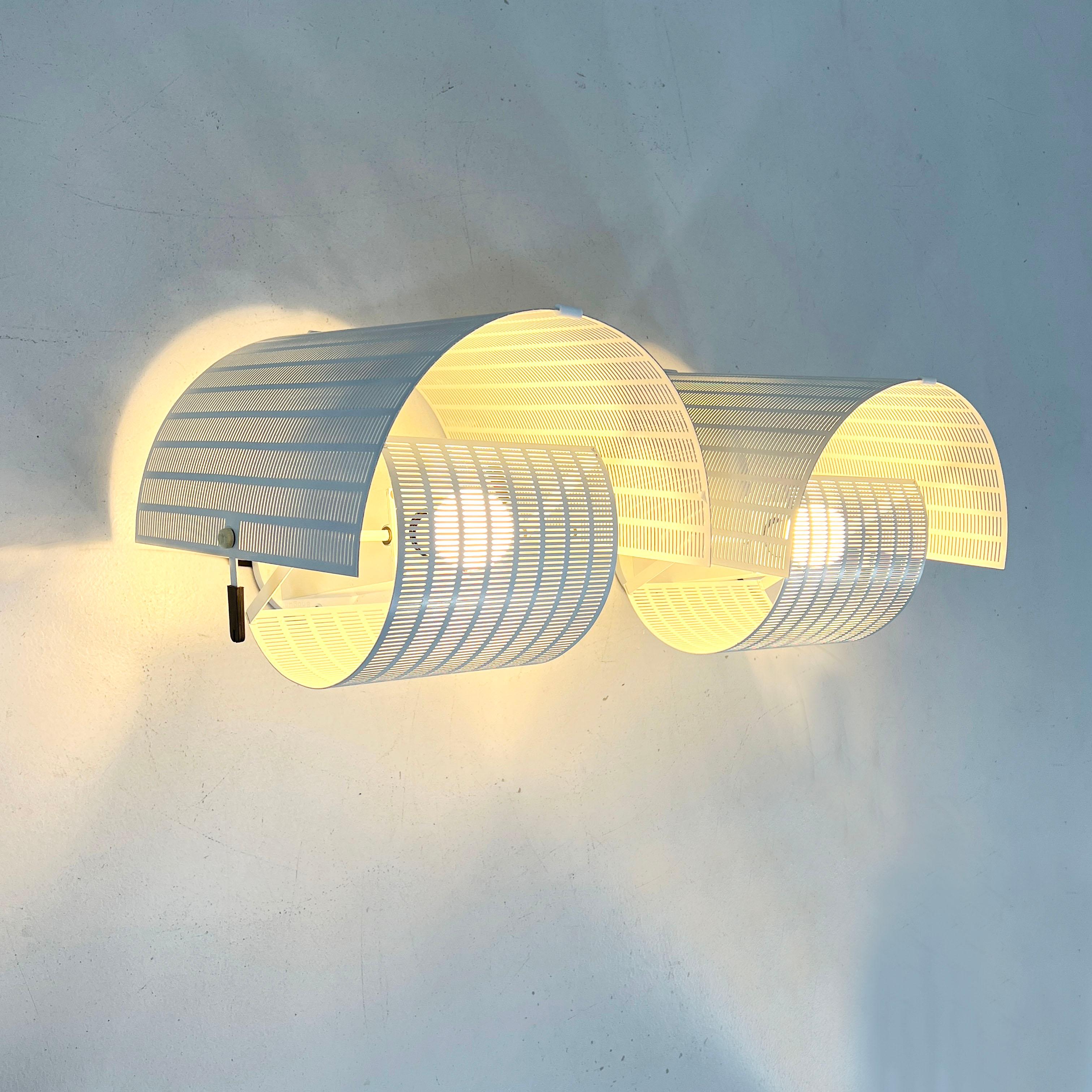 Designer - Mario Botta
Producer - Artemide
Model - Shogun Wall Lamp
Design Period - Eigthies
Measurements - Width 34 cm x Depth 33 cm x Height 32 cm
Materials - Cast Iron, Steel 
Color - White
Light wear consistent with age and use. Some light