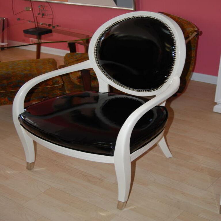 Pair of side chairs refinished in high gloss vanilla lacquer. Upholstered in a faux patent leather fabric by Robert Allen with nickel studs.

Additional information:

Materials and Techniques
Fabric, Nickel, wood

Dimensions:
Width: 24 In.