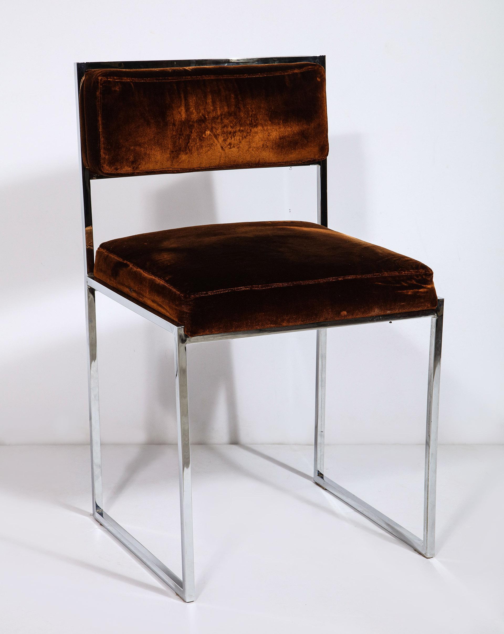 A pair of Italian postwar design 1970s polished nickel side chairs with upholstered seat and back panel.