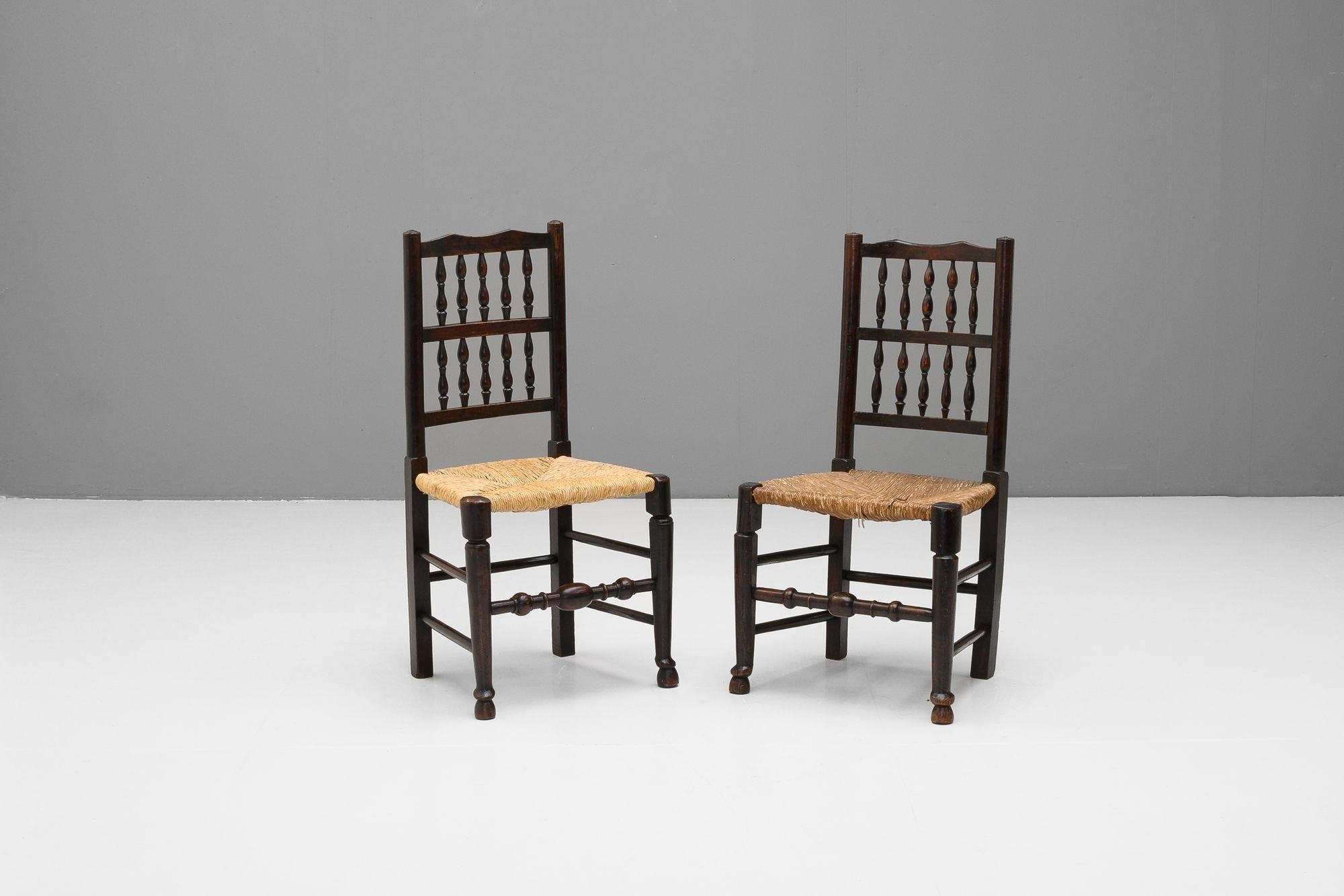 Very near pair of rail back side chairs in elm, with rush seats.
U.K circa 1800.
H 93cm (SH 44cm) x W 49cm x D 44cm