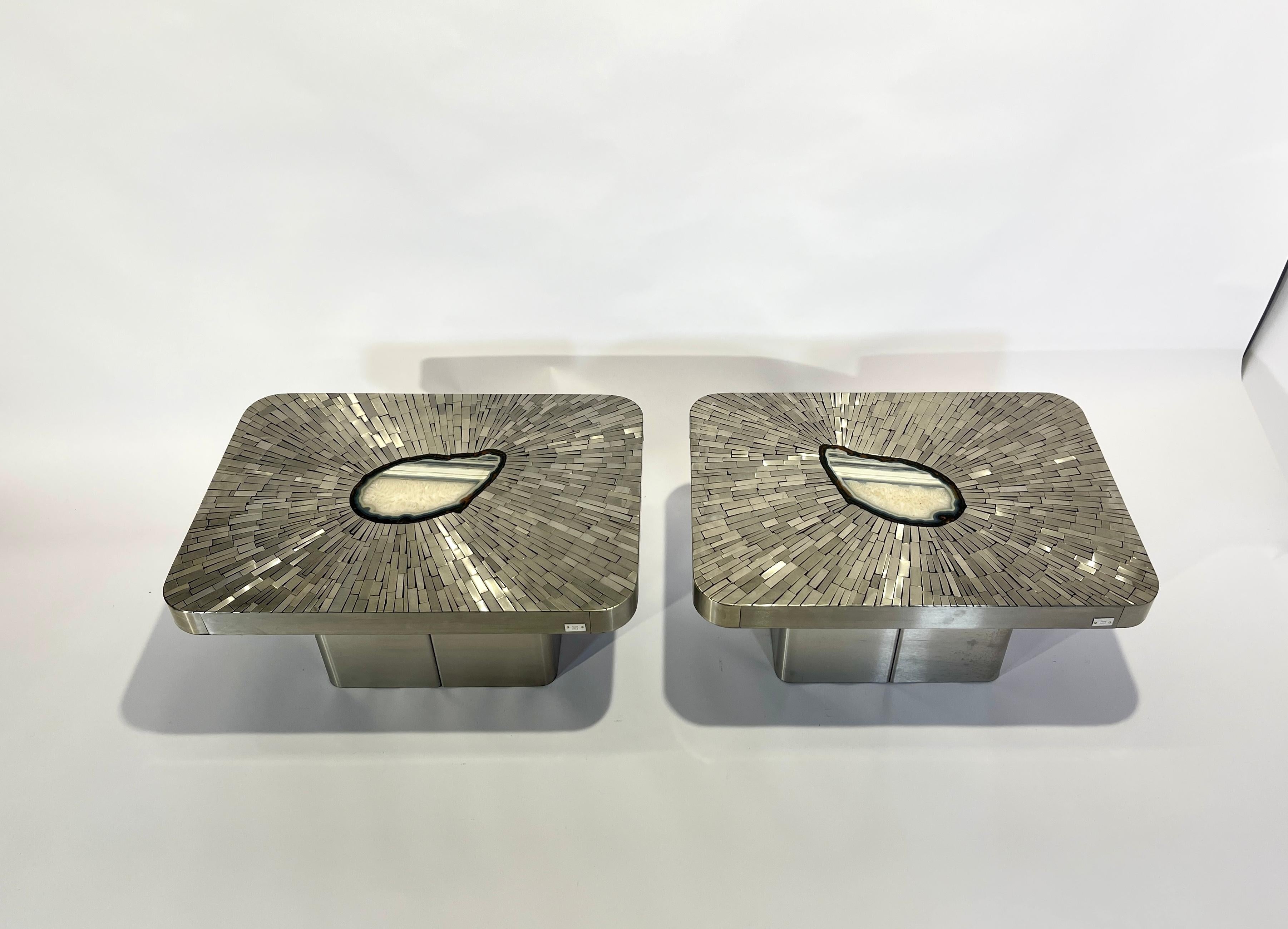 Created to measure by Stan Usel, pair of side table of stainless steel, side table topped with a magnificent mosaic stainless steel agate gemstone highlighting a mosaic radiation. Each piece is topped with a unique stone and when put together aside