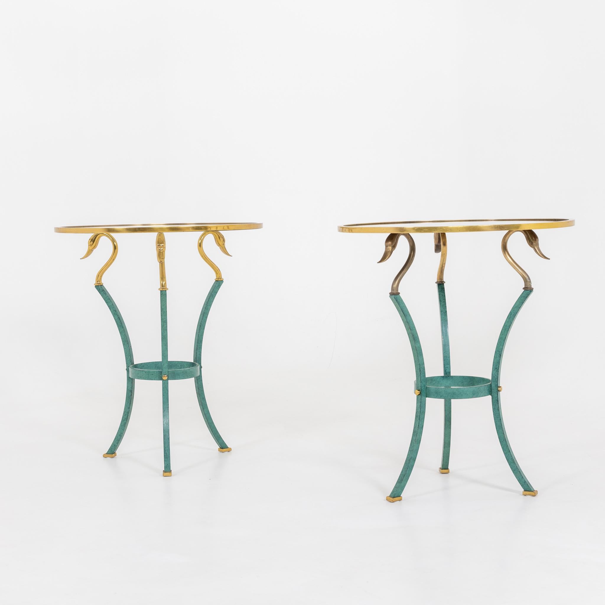 Pair of metal side tables with swan neck decor. Once with mirror and once with glass panes.