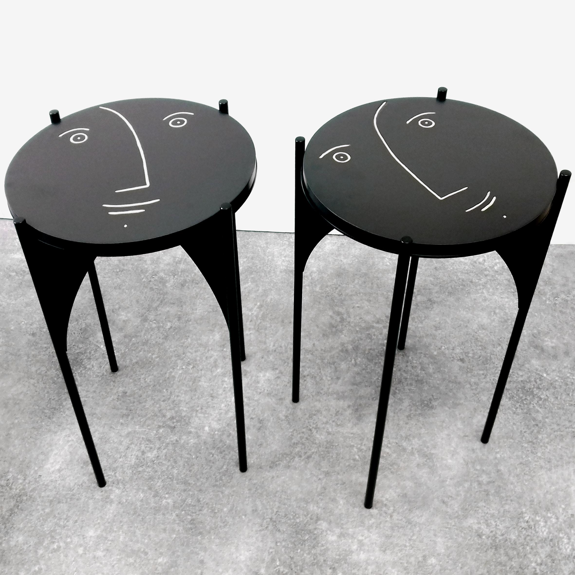 One of a kind Pair of gueridons / side tables with removable black enamel faces ceramic tops by Dalo (on black metal feet by French designer Quentin Aimable.)
