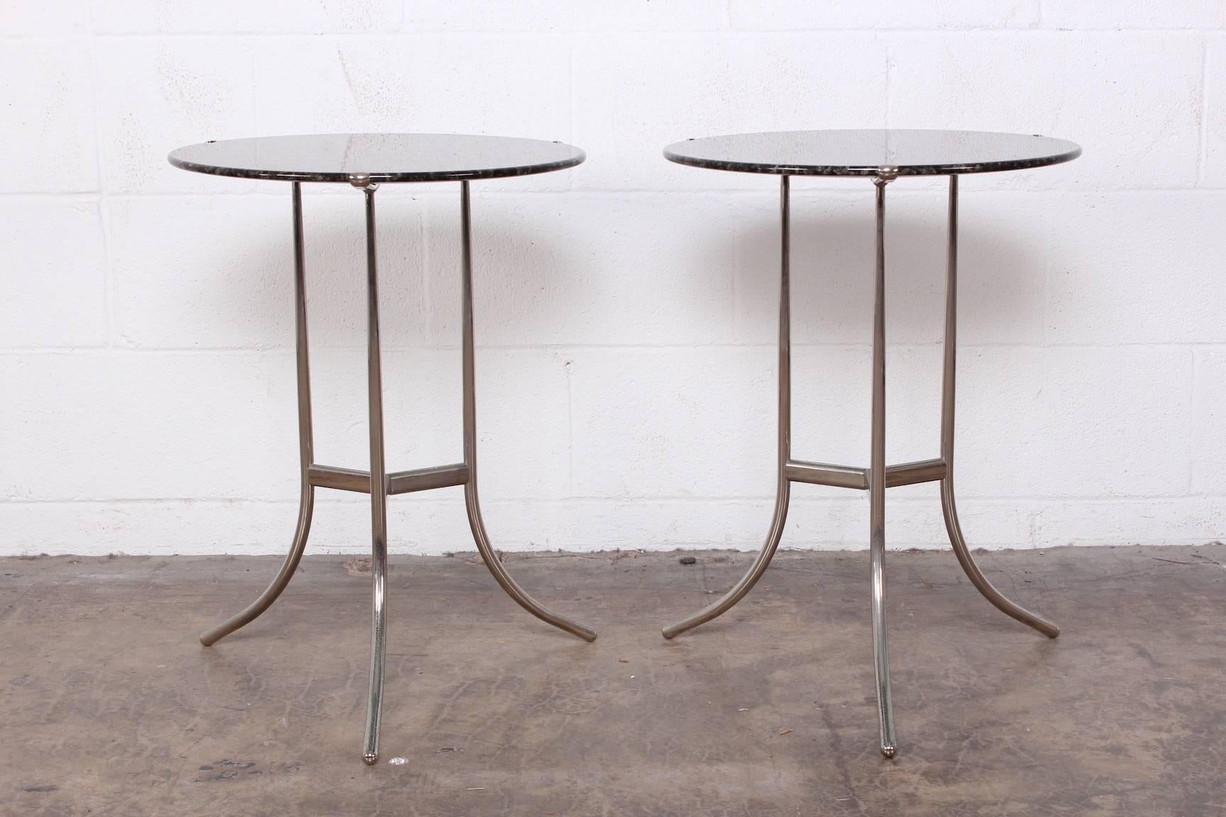 A pair of Cedric Hartman side tables with bevelled stone tops.