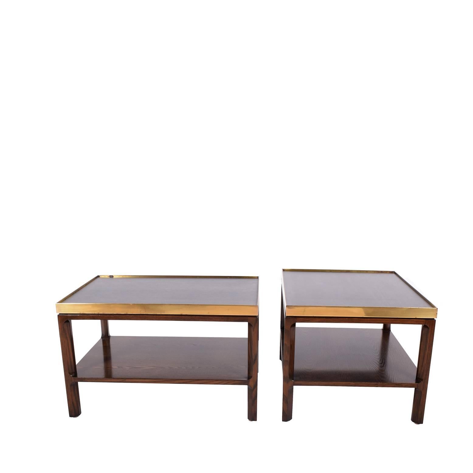 Pair of side tables with brass frame and laminate top on stain wood. Big D Dunbar label on each table.