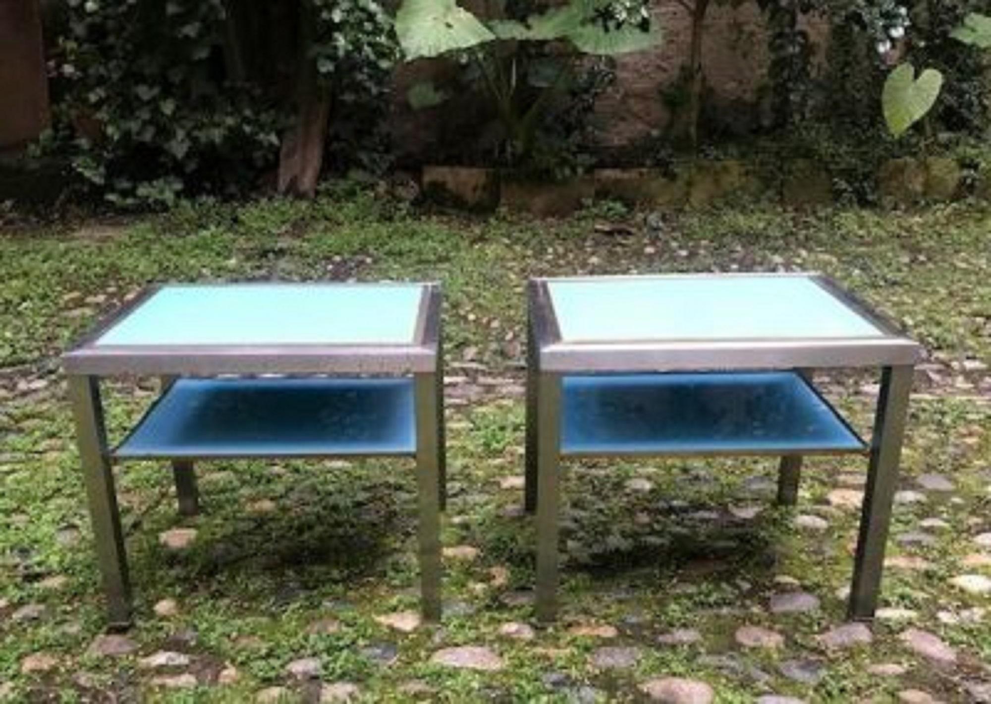 Pair of side tables in steel and brass
Two turquoise blue glass trays
Model by Guy Lefèvre for the Jansen house

Guy Lefèvre is a French designer who works on furniture like goldsmiths. … The design of the small piece of furniture is