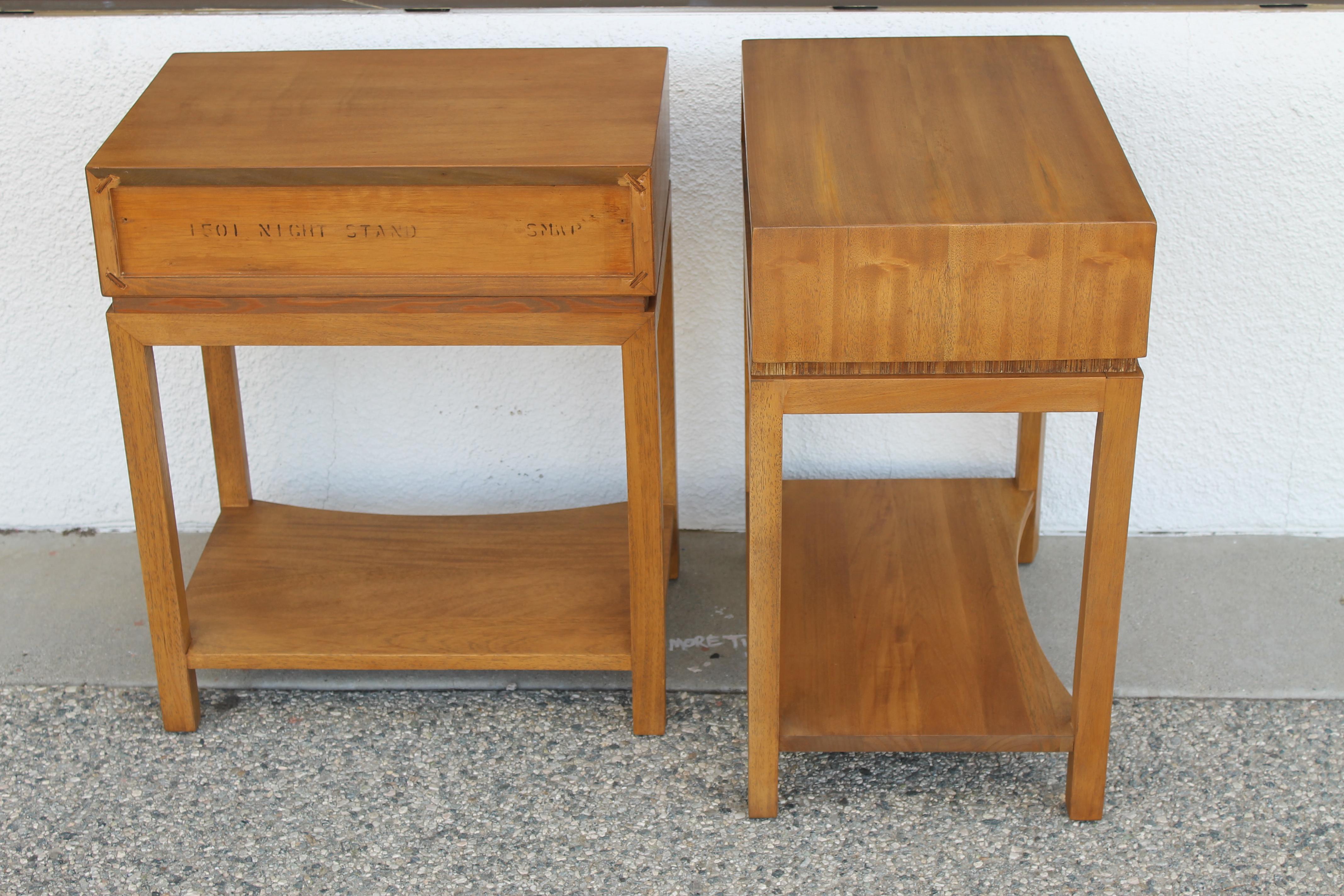 Pair of end tables by Paul Frankl for Brown Saltman of California with brass pulls. Tables have been professionally refinished. Each side table measures 20
