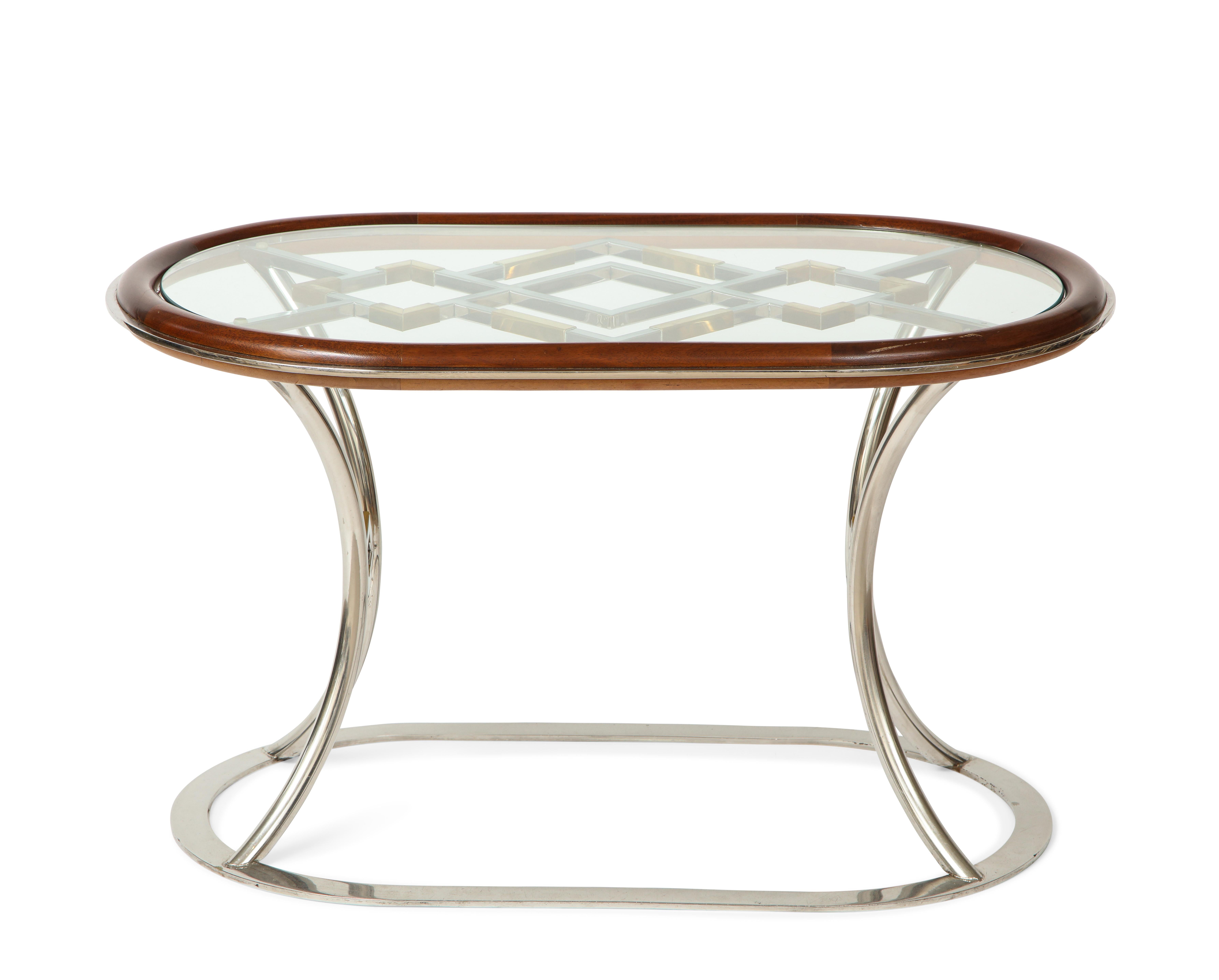 Pair of Side Tables Designed by Alain Delon for Maison Jansen

Chromed steel with bronze details. The glass top with a mahogany trim resting on a similar base.


 