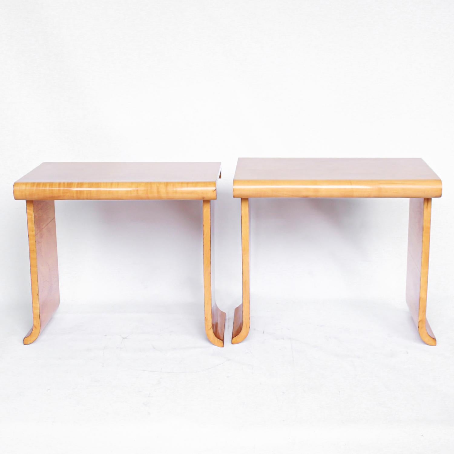 An Art Deco, pair of Epstein side tables in satin birch.

Dimensions: H 49cm, W 55cm, D 38cm

Origin: English

Date: circa 1930

Item no: 2506193.