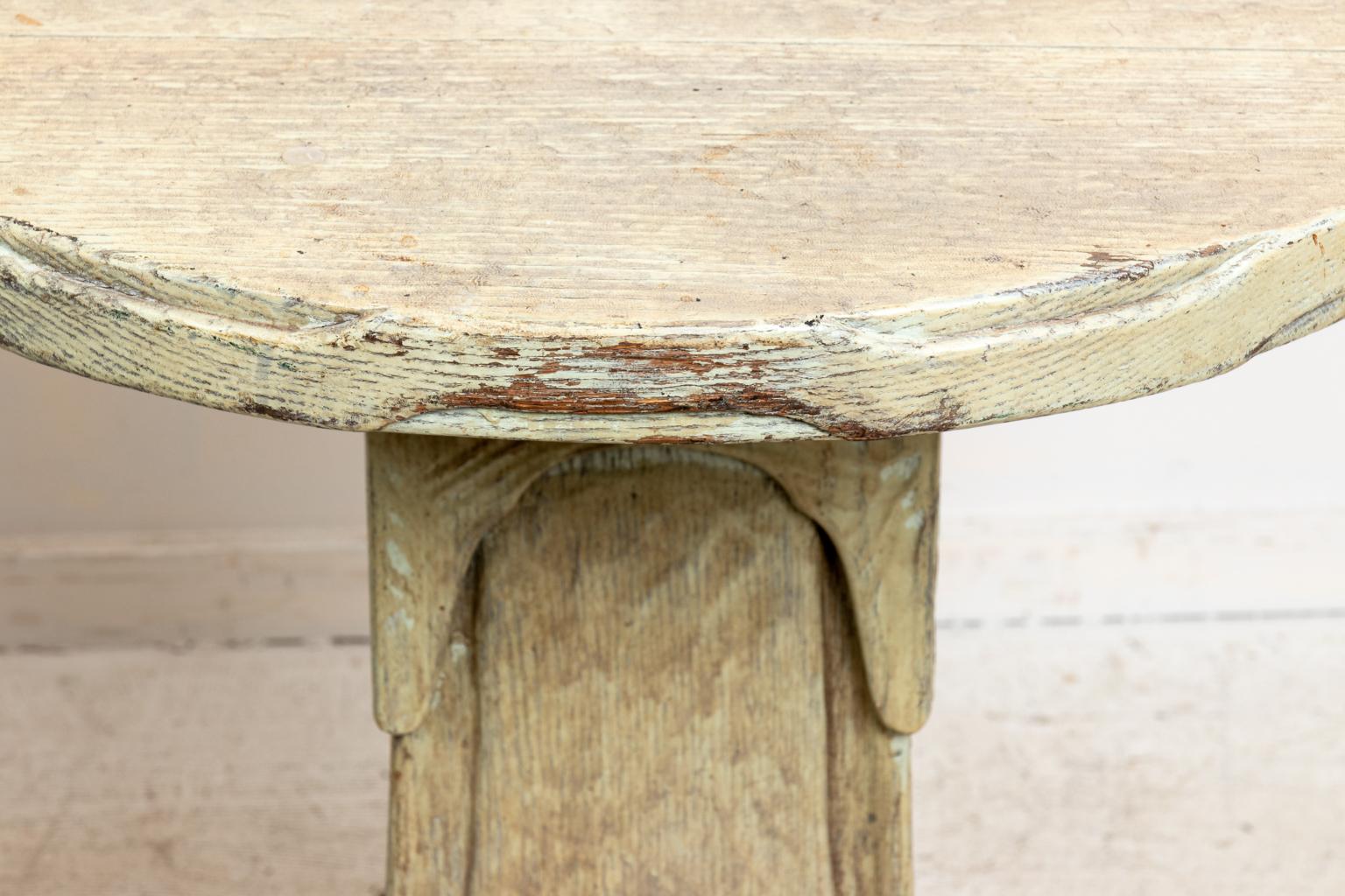 Pair of pedestal base side tables or stands in a distressed, rough hewn finish. Please note of wear consistent with age including distressed finish, patina, scratches, and chips to the wood.