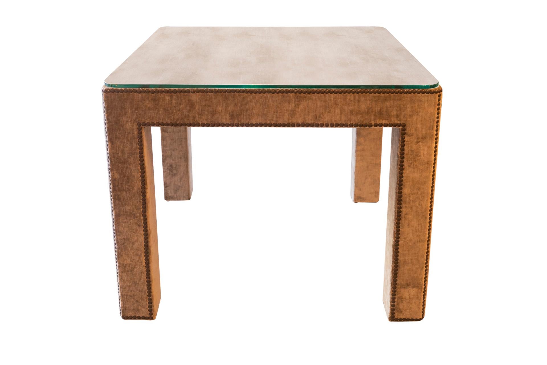 Pair of side tables,
Velvet covered wood, glass tabletop,
France, circa 1970.

Measures: 71 x 71 x 57 cm.