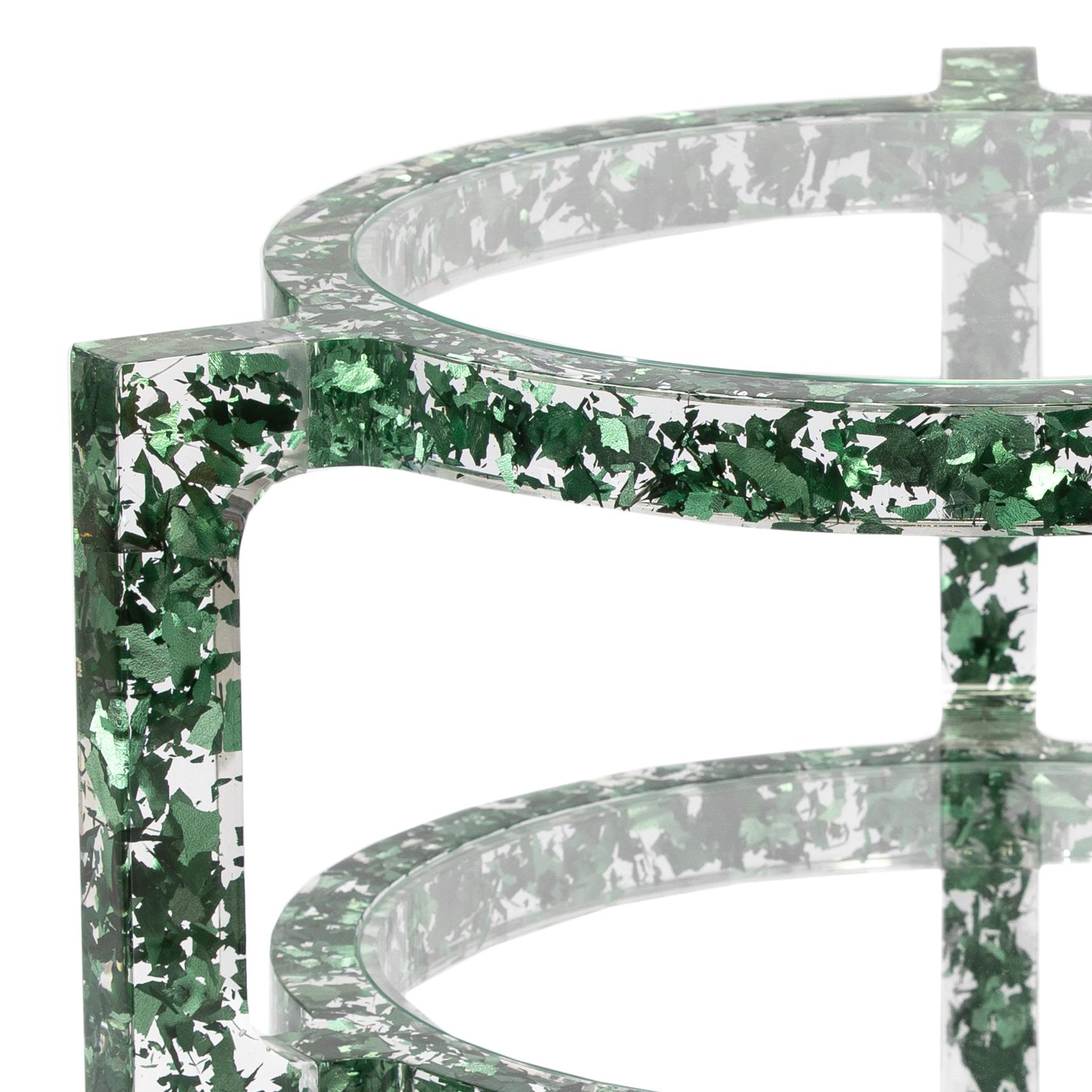 The MIDAS side table is comprised of carefully shredded colored silver-leaf, all left to randomly float in the table’s crystal clear acrylic frame. Light bounces and reflects off the leaf providing a confetti-like pattern and a unique fragmented