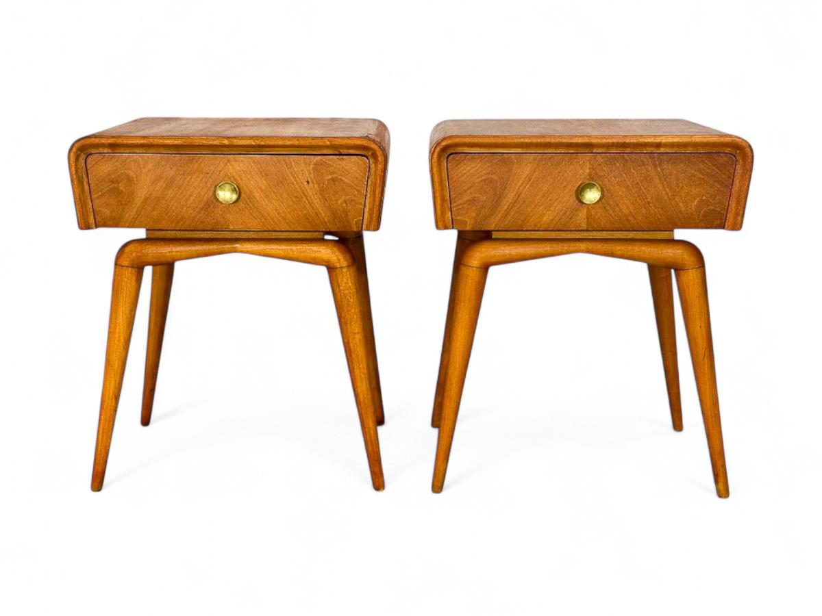 This pair of nightstands, designed by Giuseppe Scapinelli in the 1950s, is crafted from Ivorywood (Pau Marfim) and features exquisitely sculpted spider-like legs. These tables exhibit a striking organic shape and beautiful wood grain. Each table