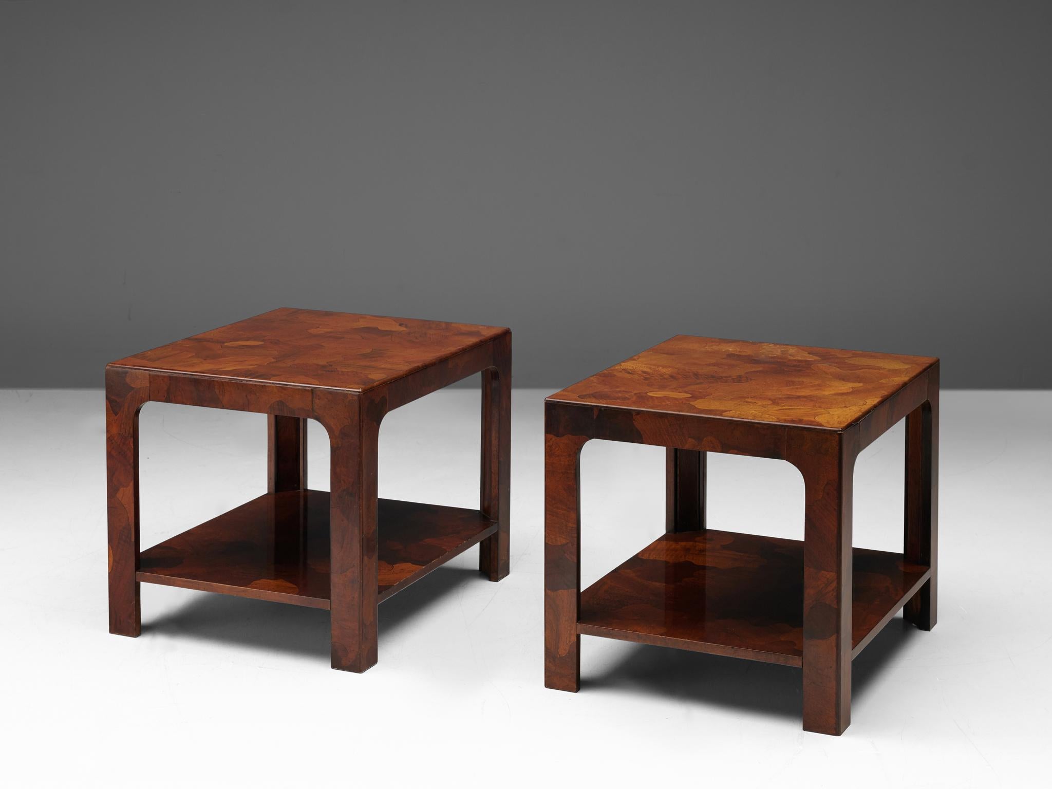 Pair of side tables, American walnut, United States, 1960s

Well designed rectangular coffee tables inlayed with organic shaped pieces of American Walnut that show a variety of tones. The coffee tables are executed with two rectangulars on top of
