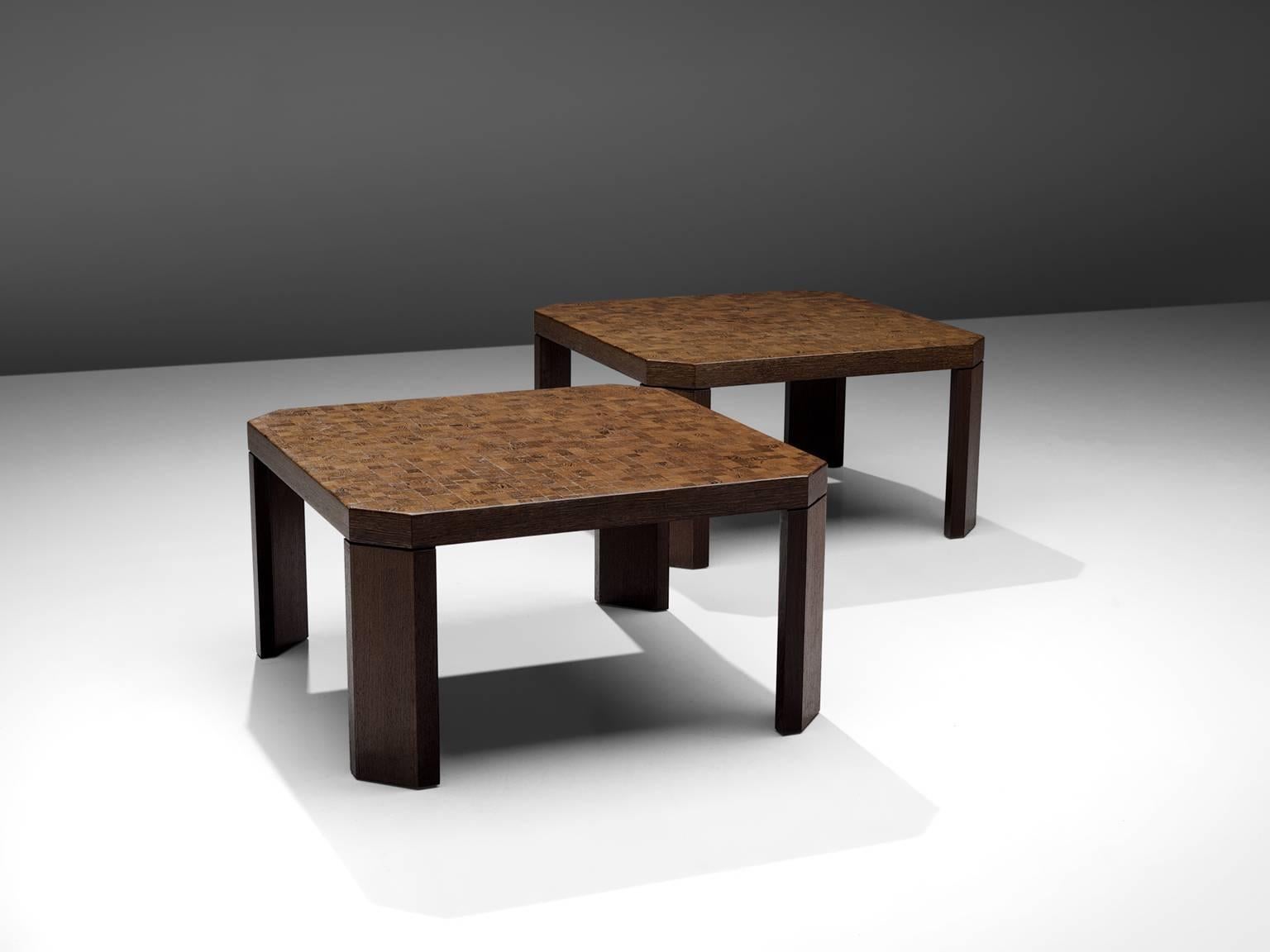 Side tables, wenge, Europe, 1970s.

This architectural set of coffee tables has four angled legs that are placed inwards. The corners of the tables are therefore not sharp as with a clean square but are flattened. The top of the table is made out