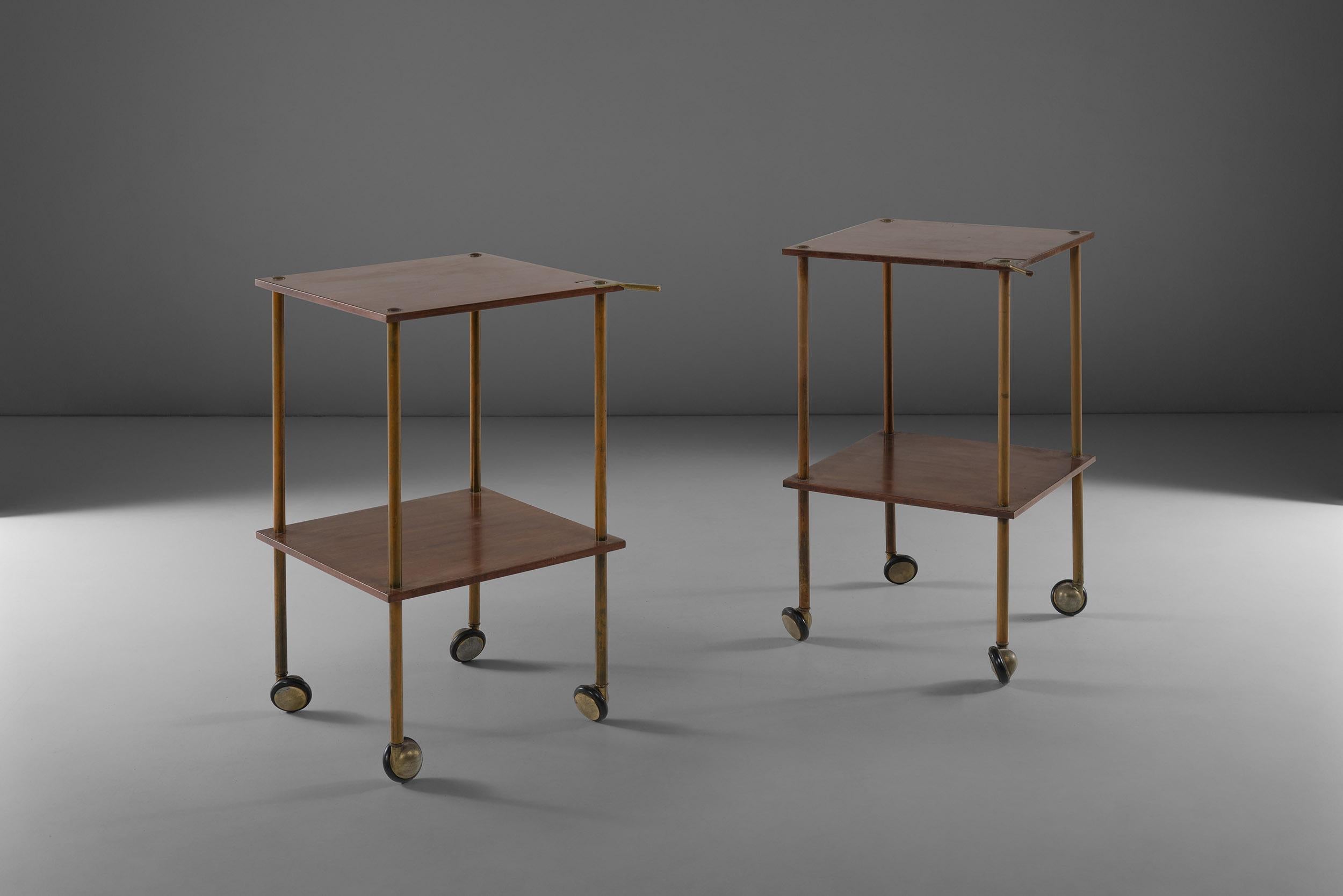 The T9 side table was designed by Luigi Caccia Dominioni for Azucena originally in 1955.
The perfect match of the wooden double shelves with the brass structure make this rare pair of side tables a true must-have. The wheels add a touch of