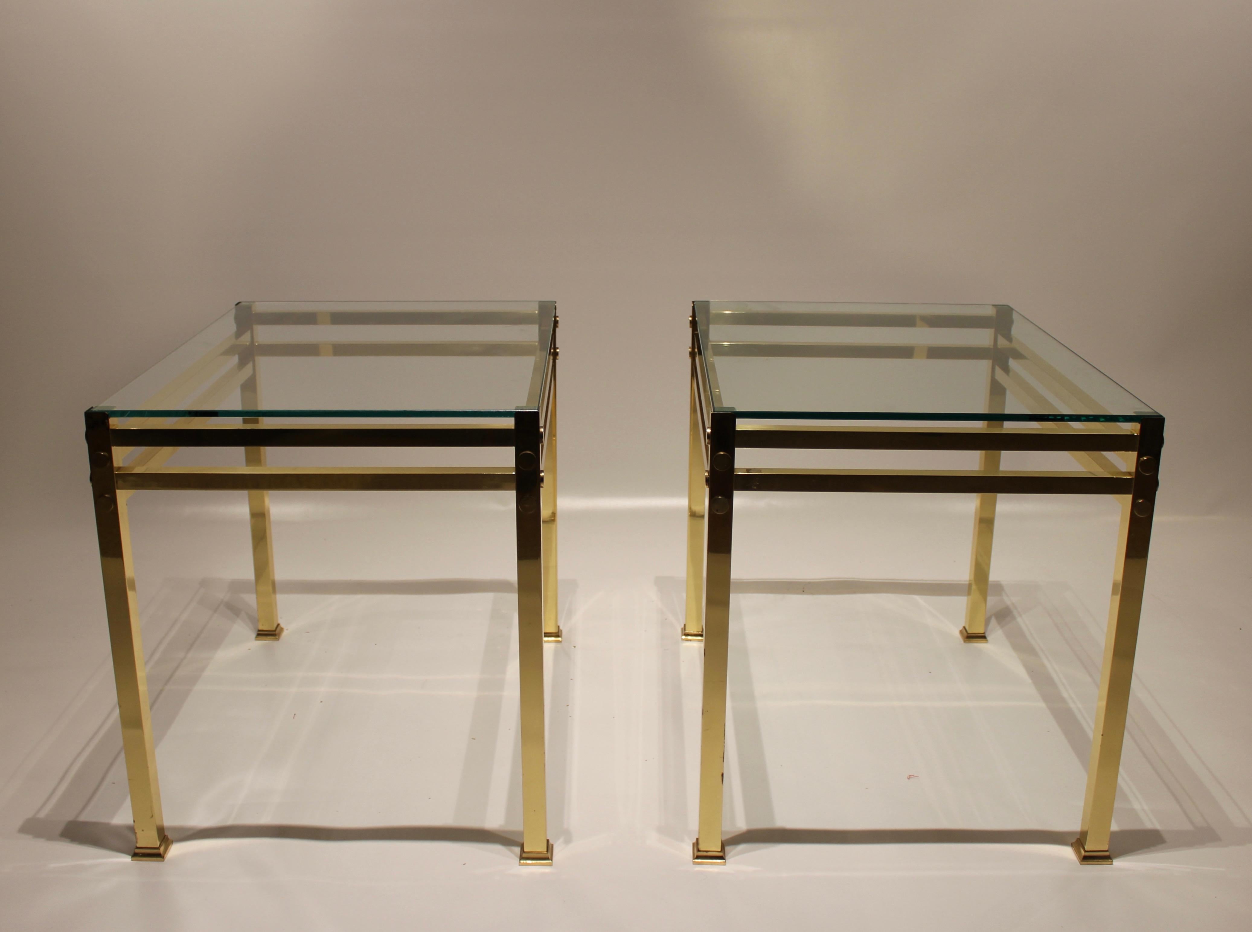 A pair of side tables of brass with plate of glass of Italian design from the 1960s. The tables are in great vintage condition.
  