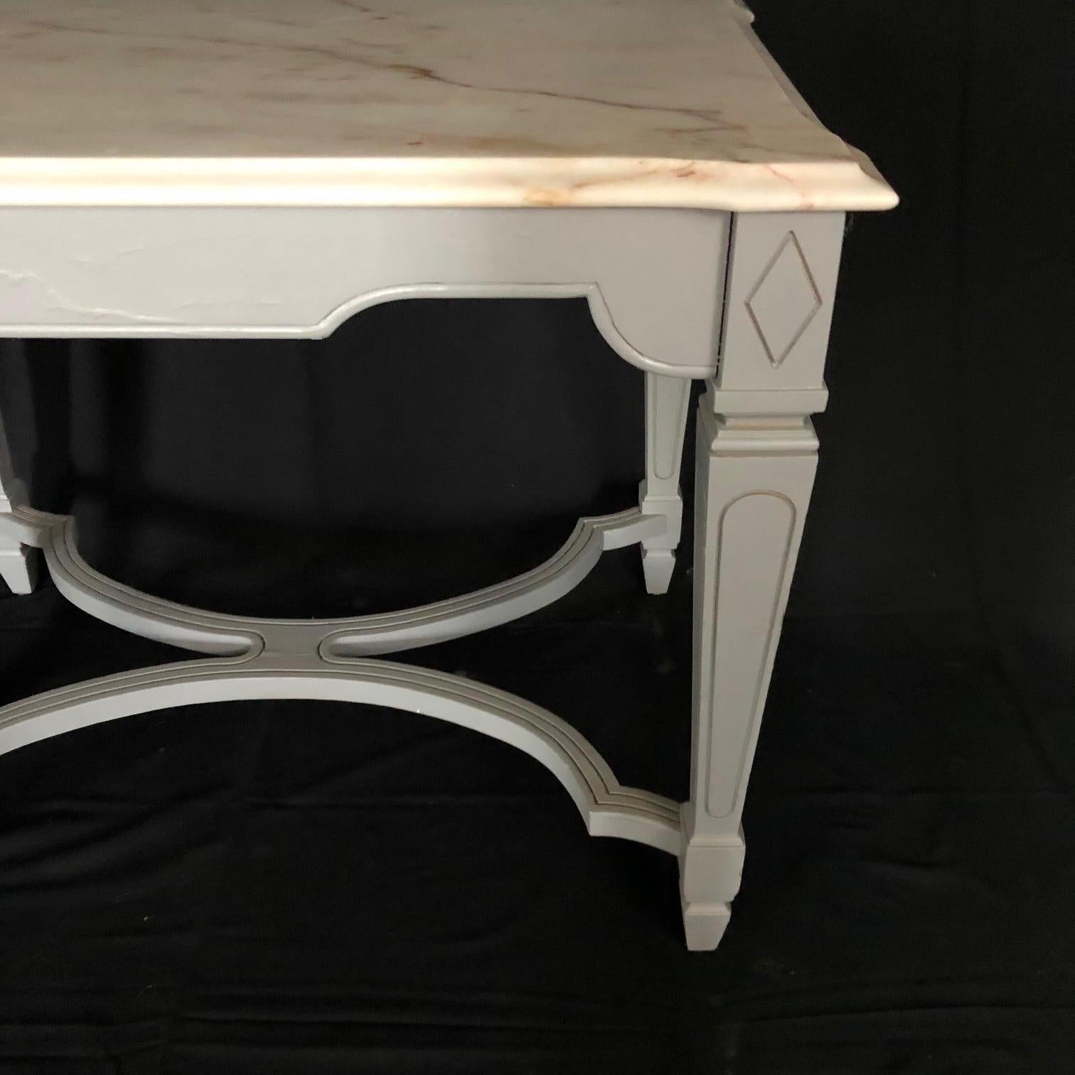 This pair of decorative and versatile side tables, nightstands or bedside tables are handcrafted using a stunning Portuguese Carrera marble. This selective thick marble is in excellent condition and has natural veining in a stunning