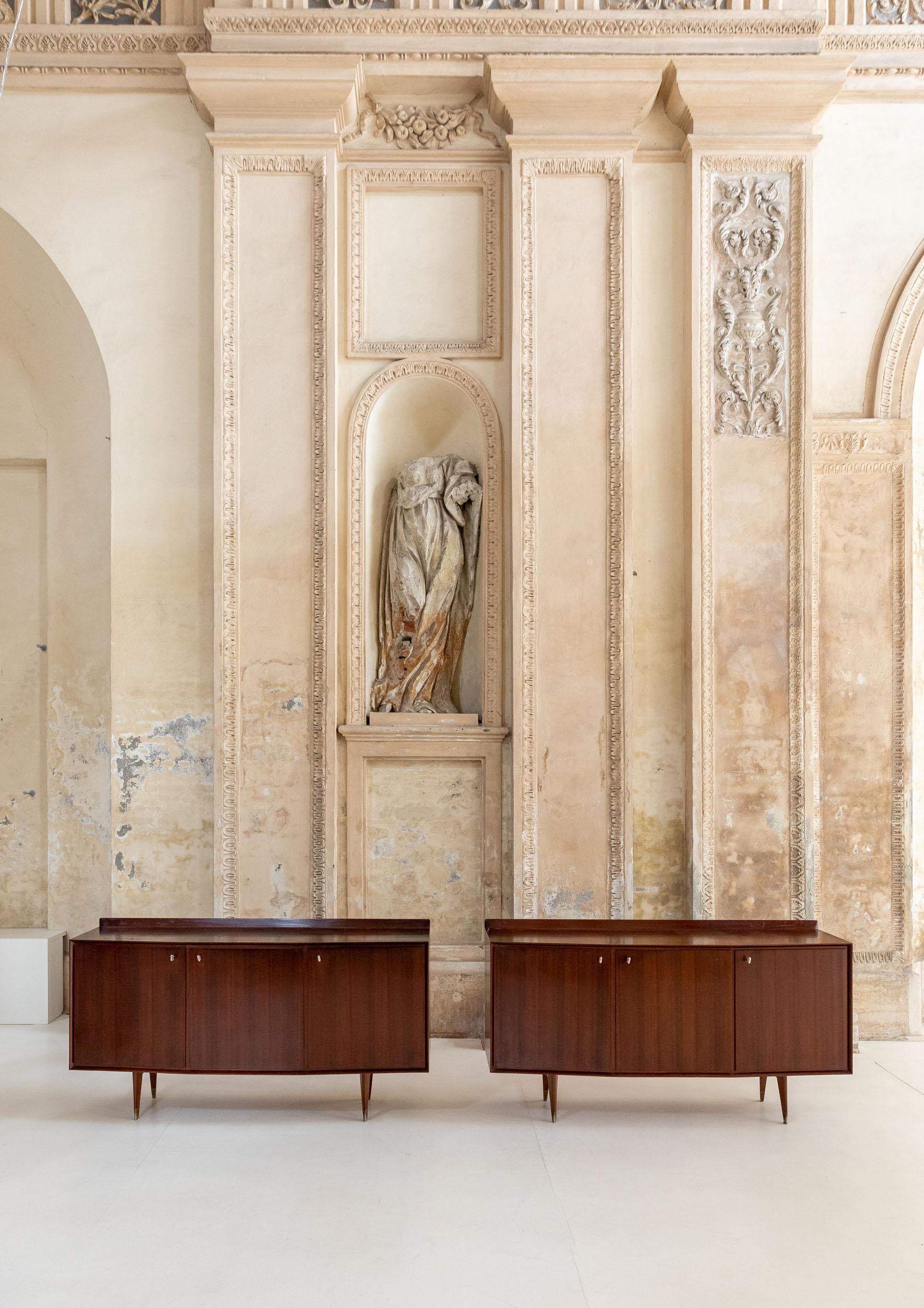 Wooden sideboards attributed to Osvaldo Borsani in 1950 circa. 
Elegant sideboards with three doors.
They features two drawers inside and beautiful details. 
Italy, 1950.