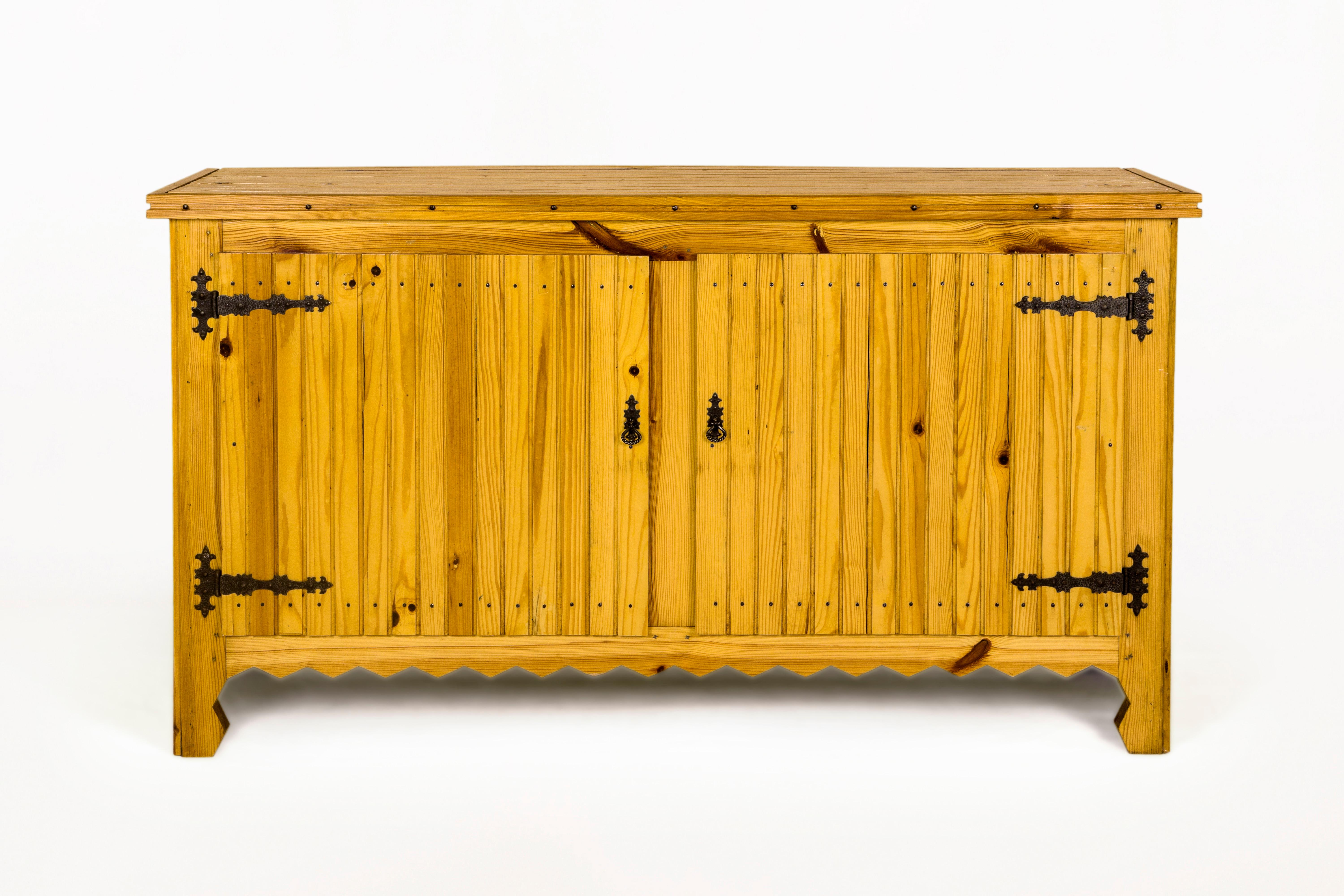 Pair of sideboards.
Made with pine.
Handcrafted iron work.
Circa 1960, Italy.
Very good vintage condition.
Mid-Century Modern (MCM) is a design movement in interior, product, graphic design, architecture, and urban development that was popular from