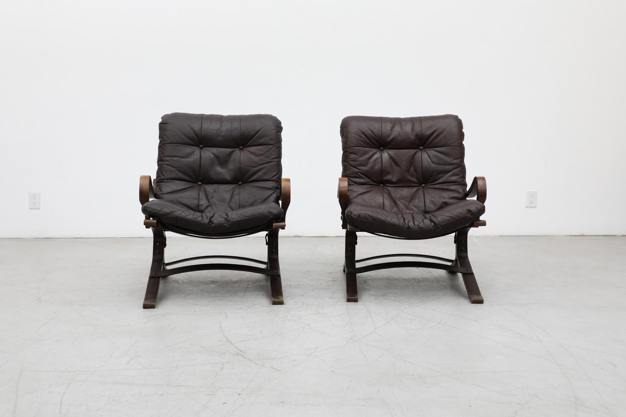 Pair of Westnofa 'Siesta' lounge chairs with bent wood frame, laced canvas sling support and original dark brown leather cushions. Designed by Ingmar Relling. In original condition with visible wear consistent with their age and use. Visible wear