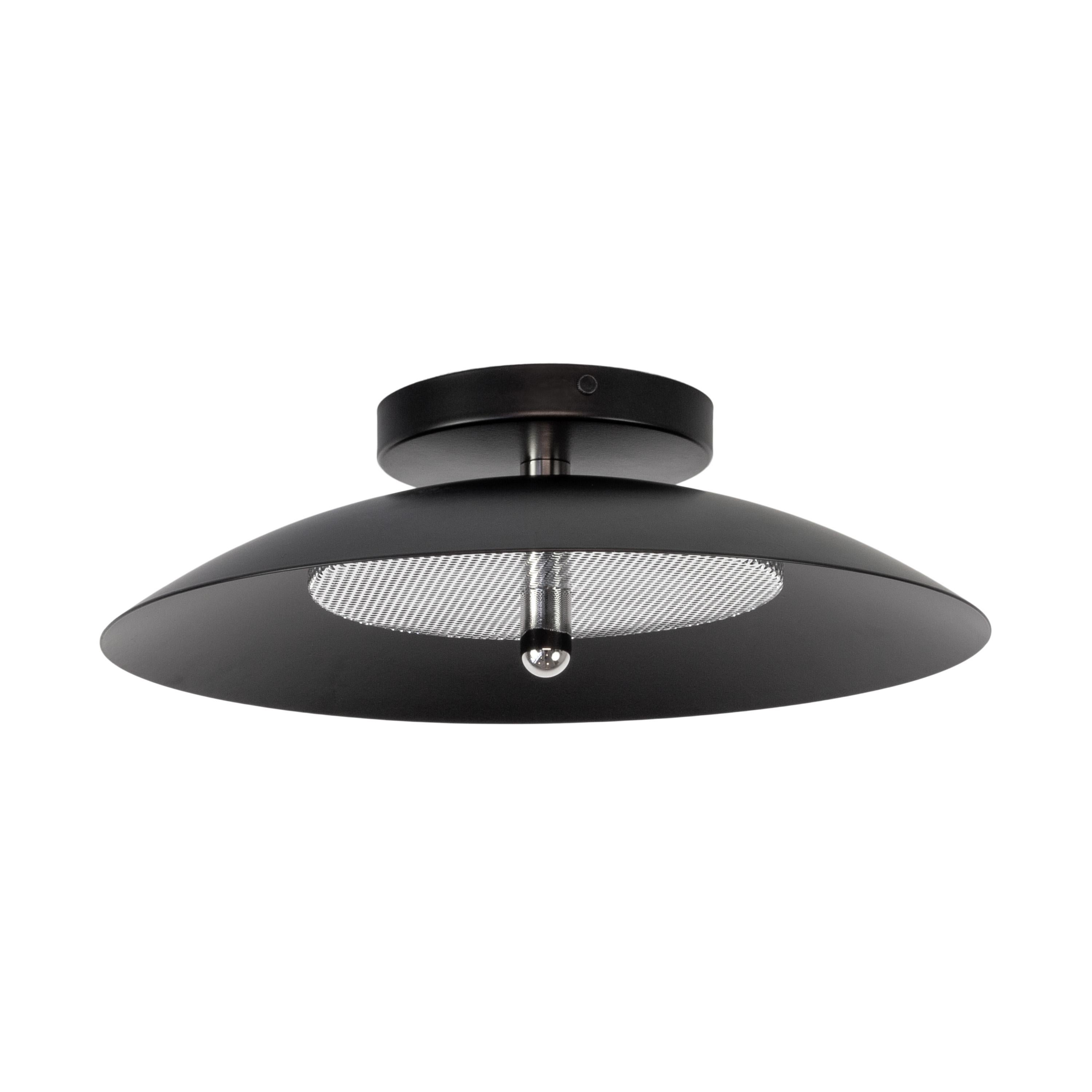 This listing is for 2 Flush Mount from Souda.
Composed of a spun metal shade that reflects light filtered through a perforated metal diffuser, the subtle warmth of the signal sconce is perfectly balanced by it’s striking form. With their refined