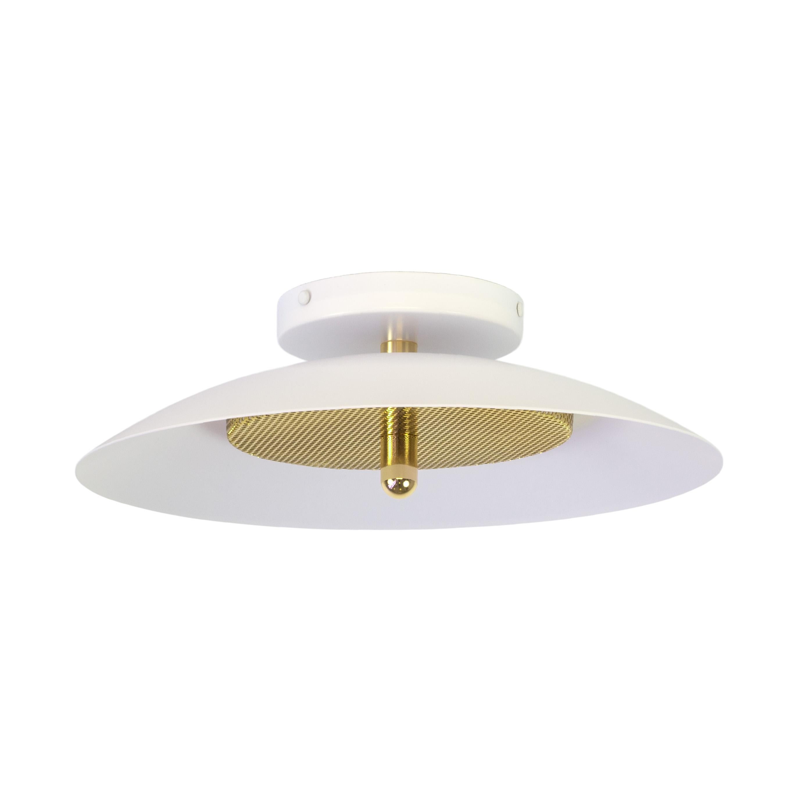 This listing is for 2 flush mount from Souda.
Composed of a spun metal shade that reflects light filtered through a perforated metal diffuser, the subtle warmth of the signal sconce is perfectly balanced by it’s striking form. With their refined