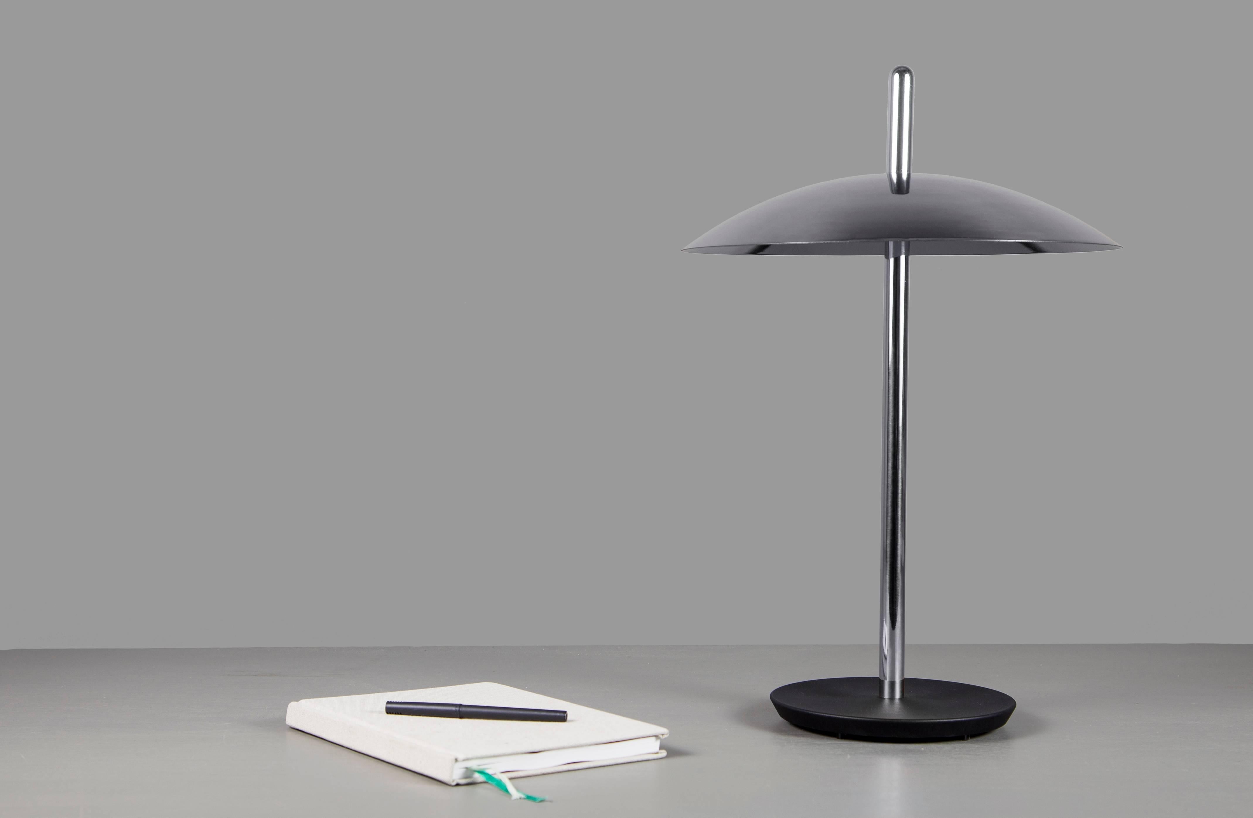 The signal table lamp is familiar, yet futuristic. From beneath it’s spun metal shade LEDs cast a warm and inviting glow onto a polished central stem grounded by a cast iron base. With it’s refined form and multiple finish options the signal table