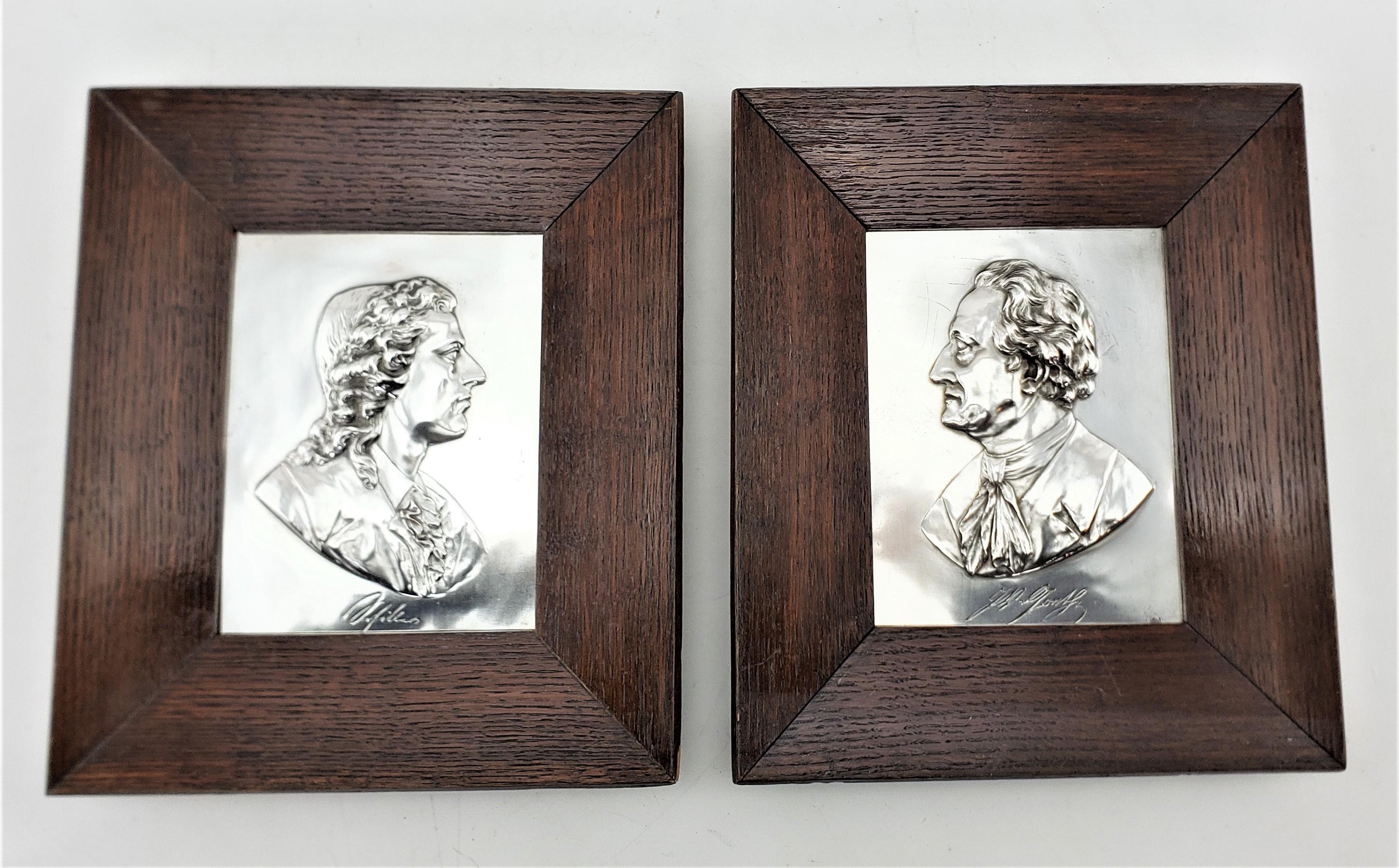 This pair of antique wall plaques are possibly signed by an unknown artist, or identify the respective individuals in both, and are presumed to originate from England and date to approximately 1880 and done in the period Victorian style. The wall