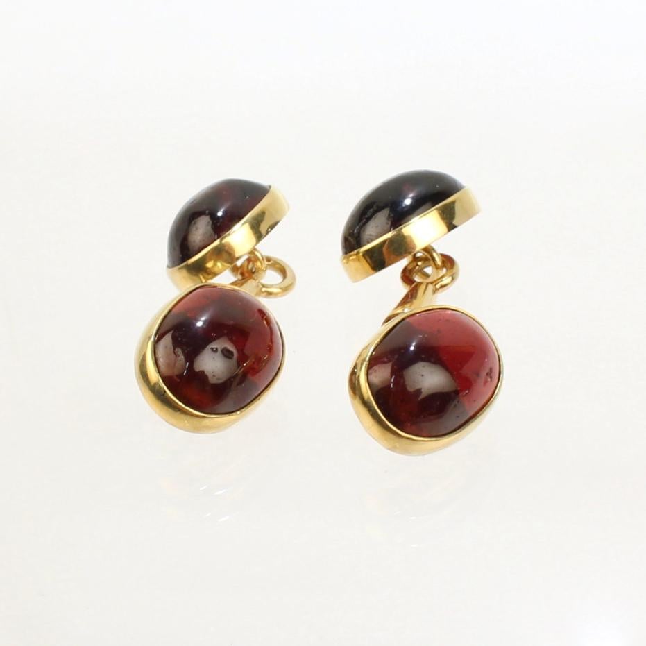 A very fine pair of antique Edwardian period Austrian cufflinks.

In 14k gold and set with garnet cabochon gemstones.

A wonderful pair of cufflinks for the well dressed man!

Date:
Early 20th Century

Overall Condition:
They are in overall good,