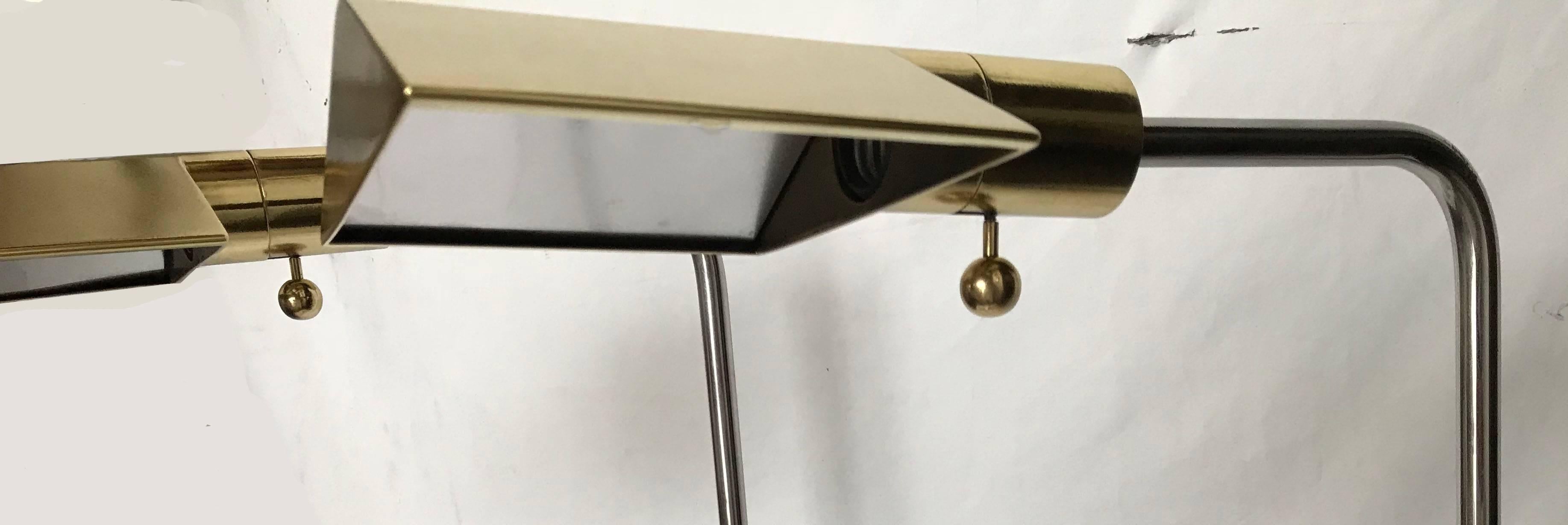 Pair of brass and chrome Cedric Hartman floor lamp.
Perfect condition 
80 watt bulb
Wired for US and in working condition
Measure: foot 11:L, 1.5' D ,1