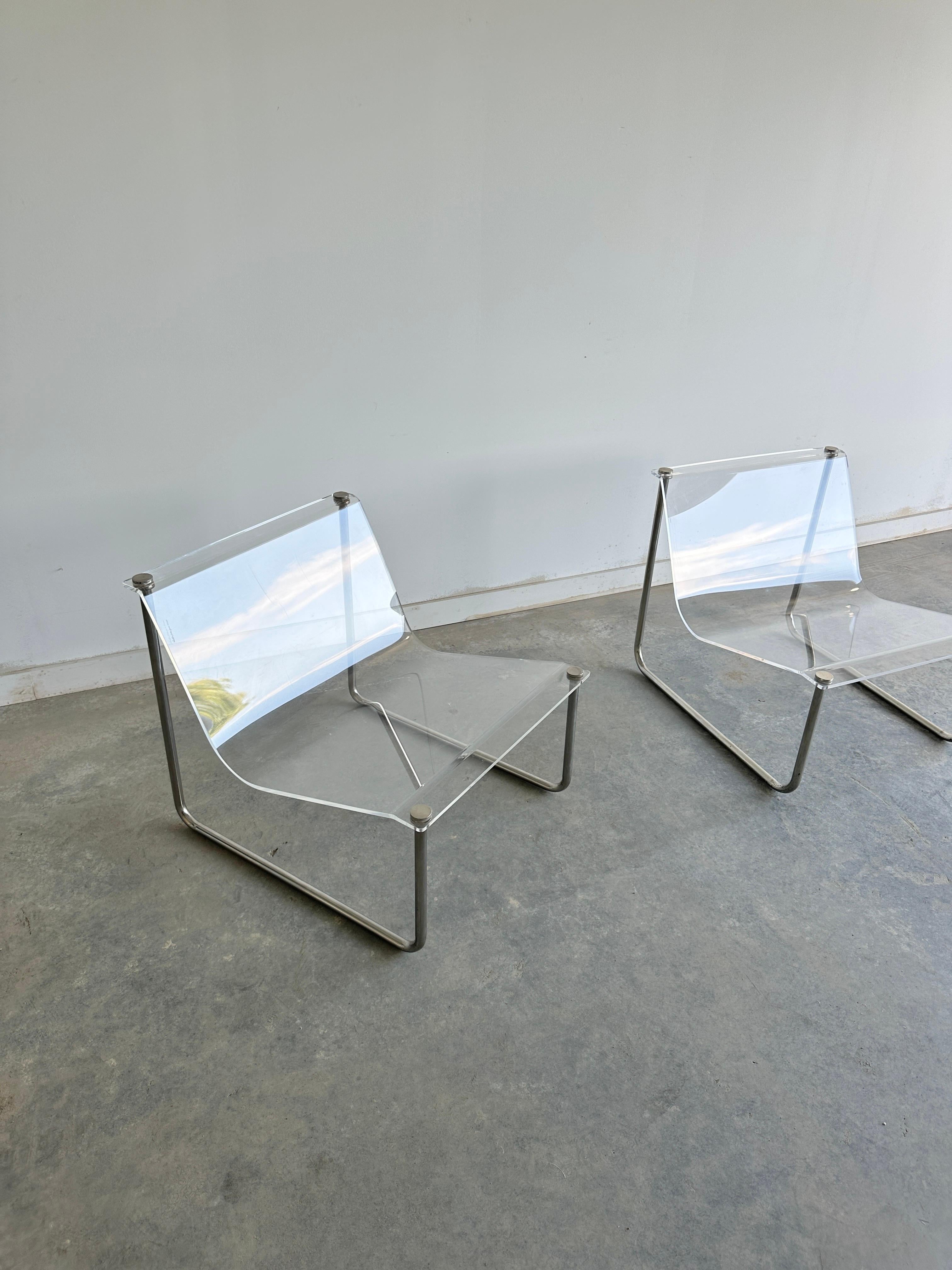 Polished Pair of signed clear lucite and chrome sling chairs by Charles Hollis Jones For Sale