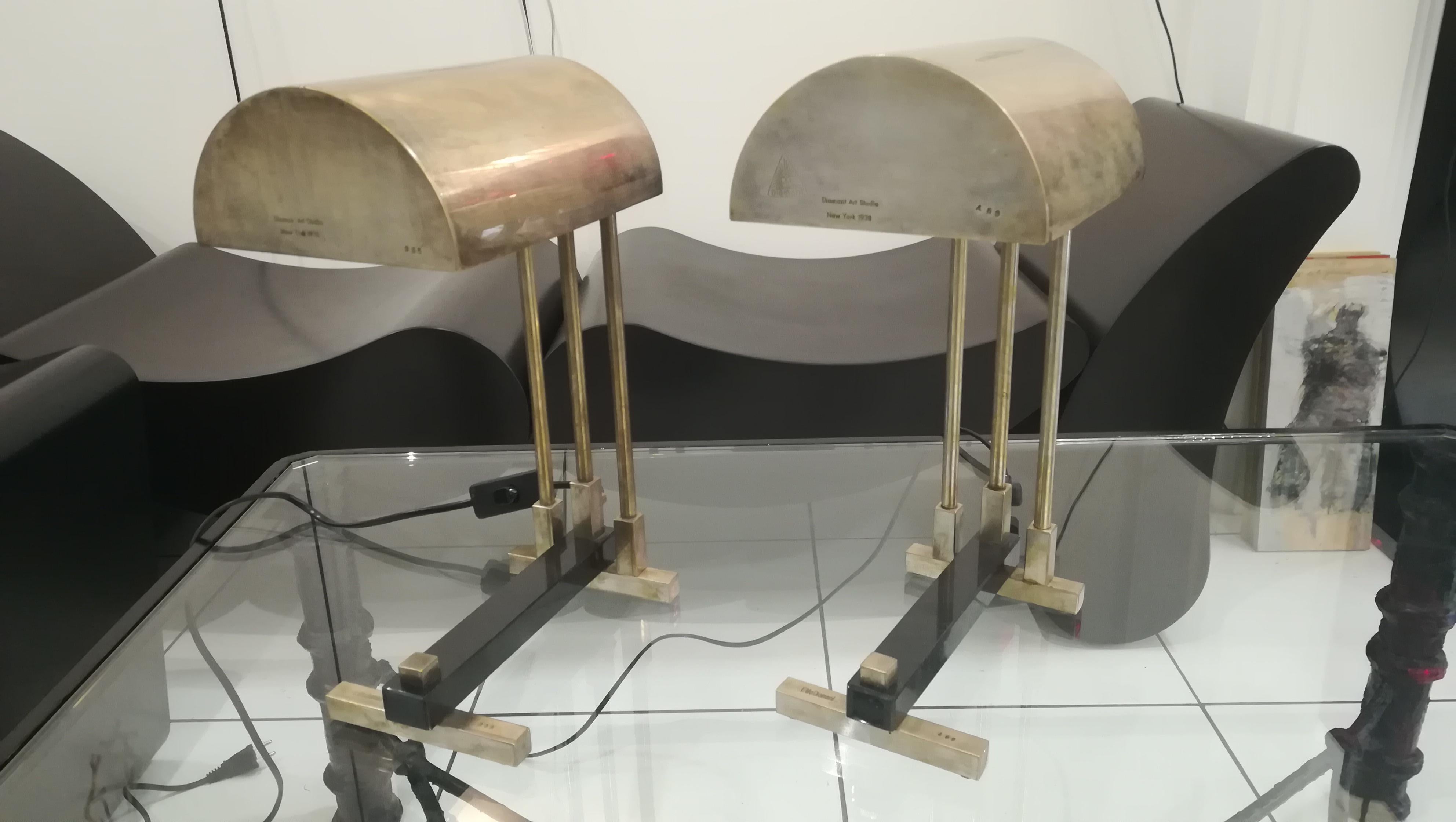 Pair of signed Elite Diamant lamps, nickel-plated brass and marble base

They are signed 'Elite Diamant, numbered 355 and 469 on the feet, and diamant art studio Newyork 1938 on the shades, with mark of the manufacturer.
Fully rewired and