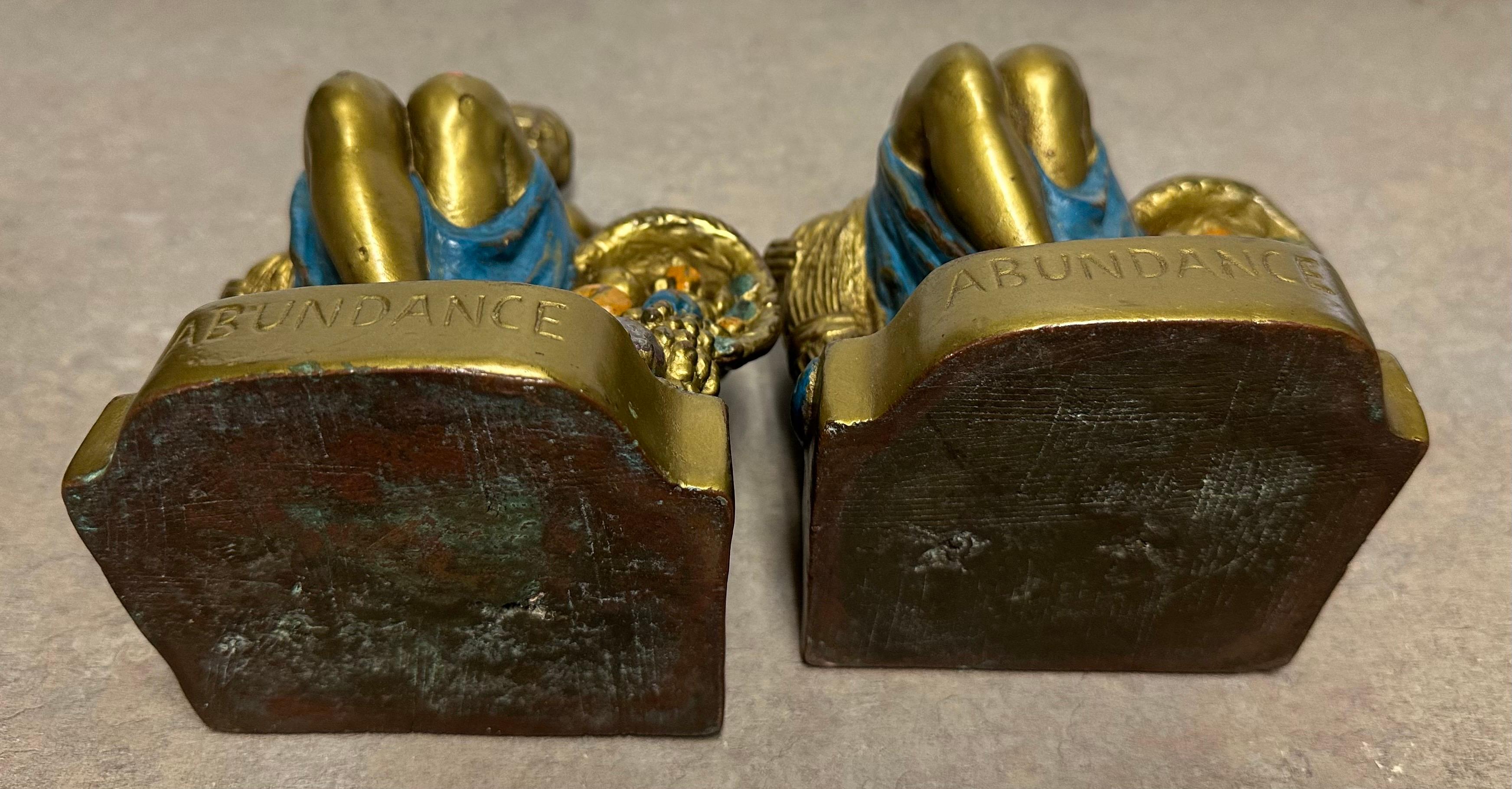 Coppia di fermalibri firmati 