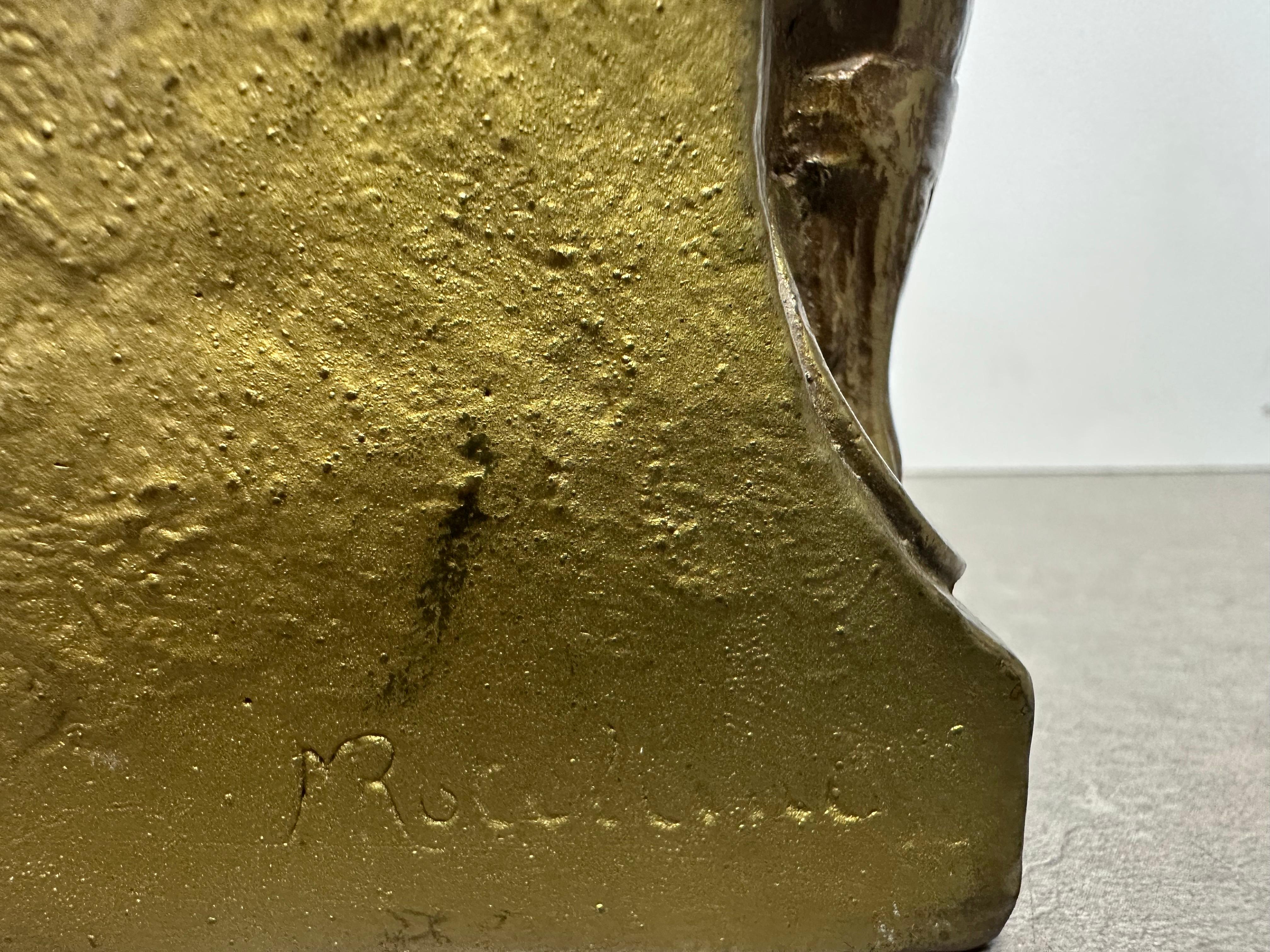 Coppia di fermalibri firmati 