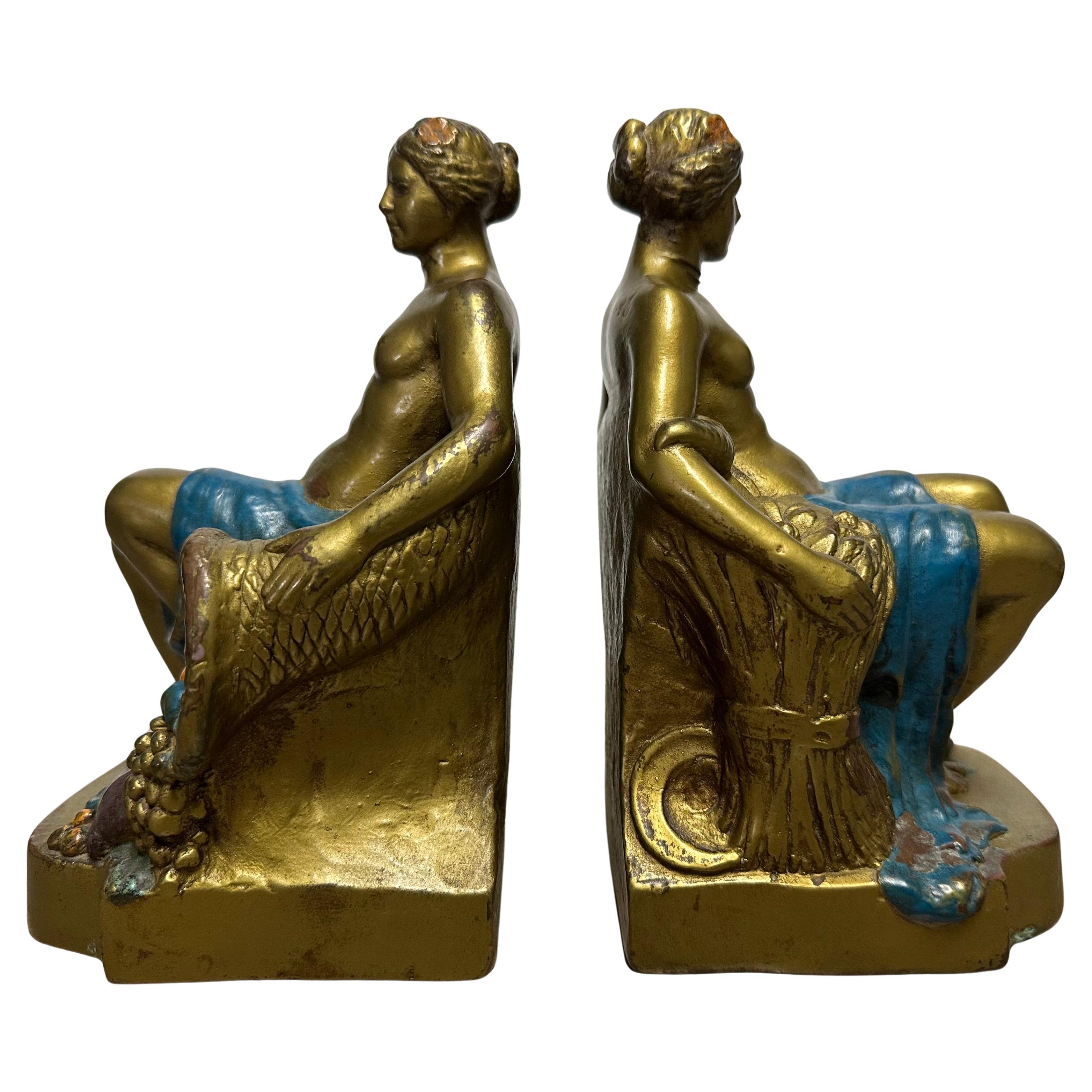 Coppia di fermalibri firmati 