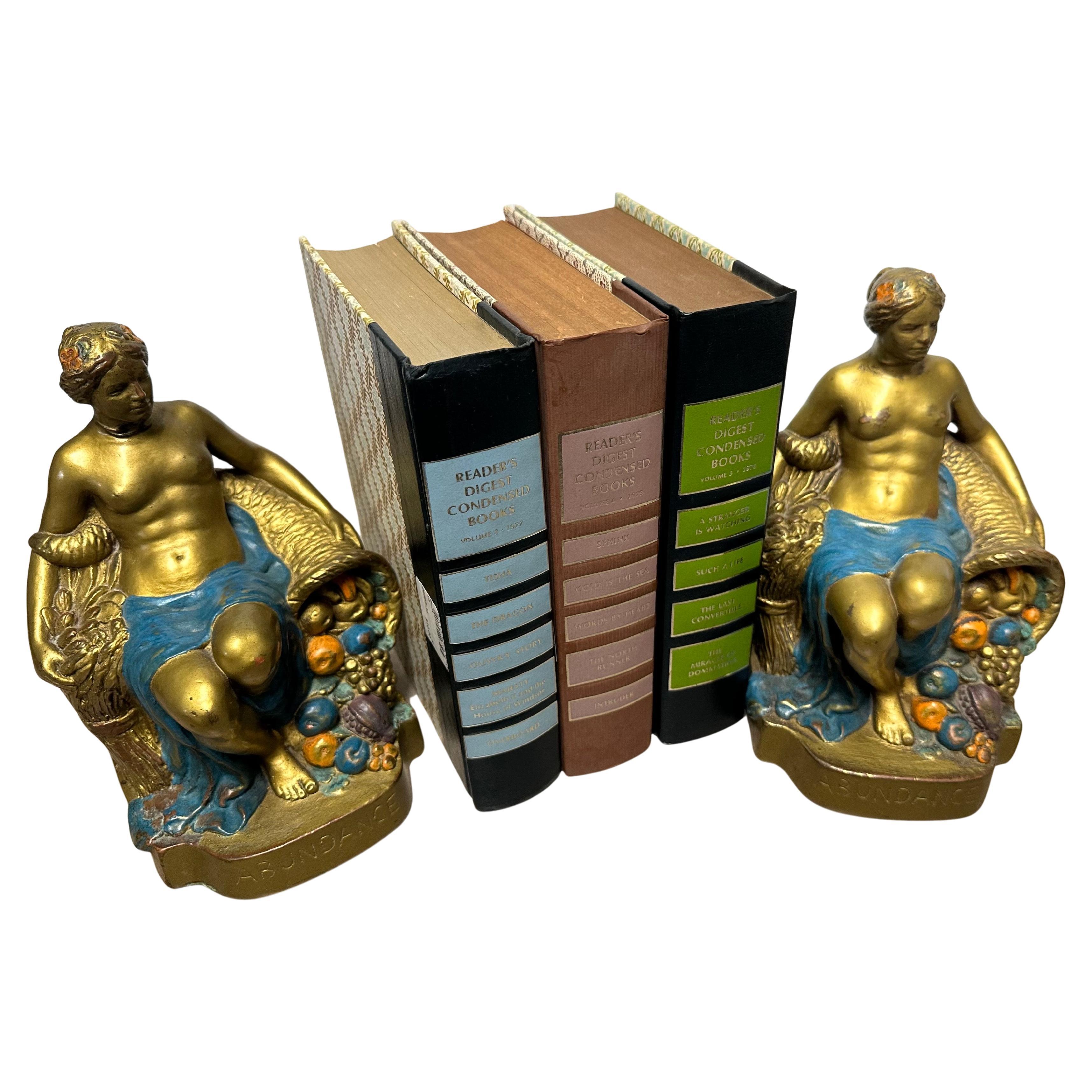 Bronzo Coppia di fermalibri firmati 