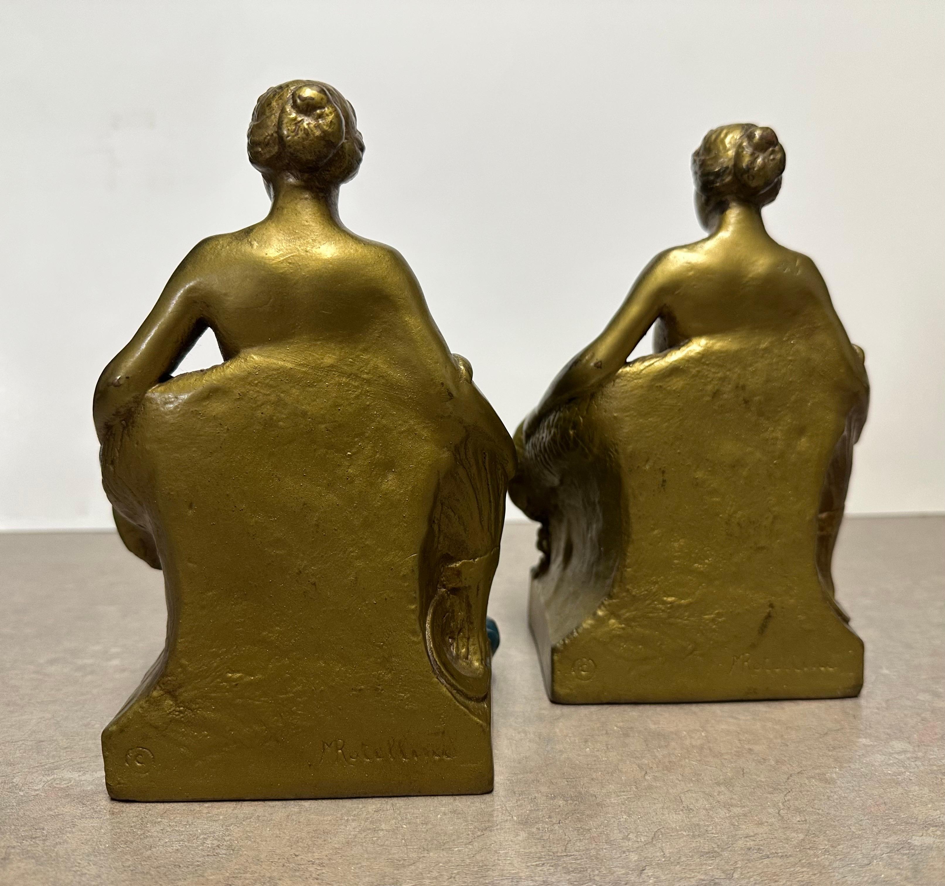 Coppia di fermalibri firmati 