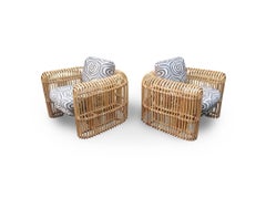 Paire de chaises longues signées Henry Olko en rotin et canne Rib Series