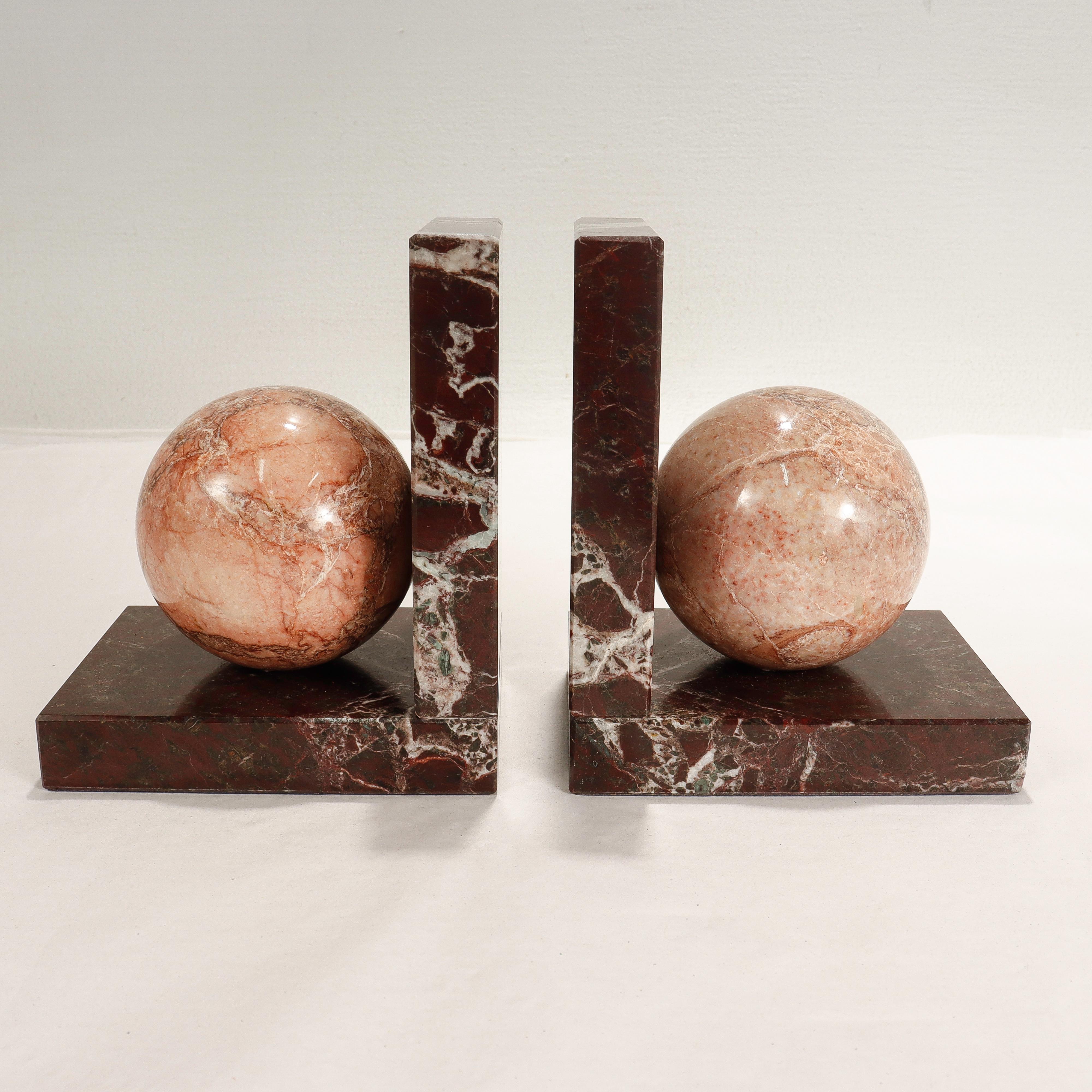 A fine pair of Italian marble bookends.

With burgundy & pink marble varieties.

With an R. Romanelli label to the base along with felt pads.

Simply a wonderful pair of bookends!

Date:
20th century

Overall condition:
They are in
