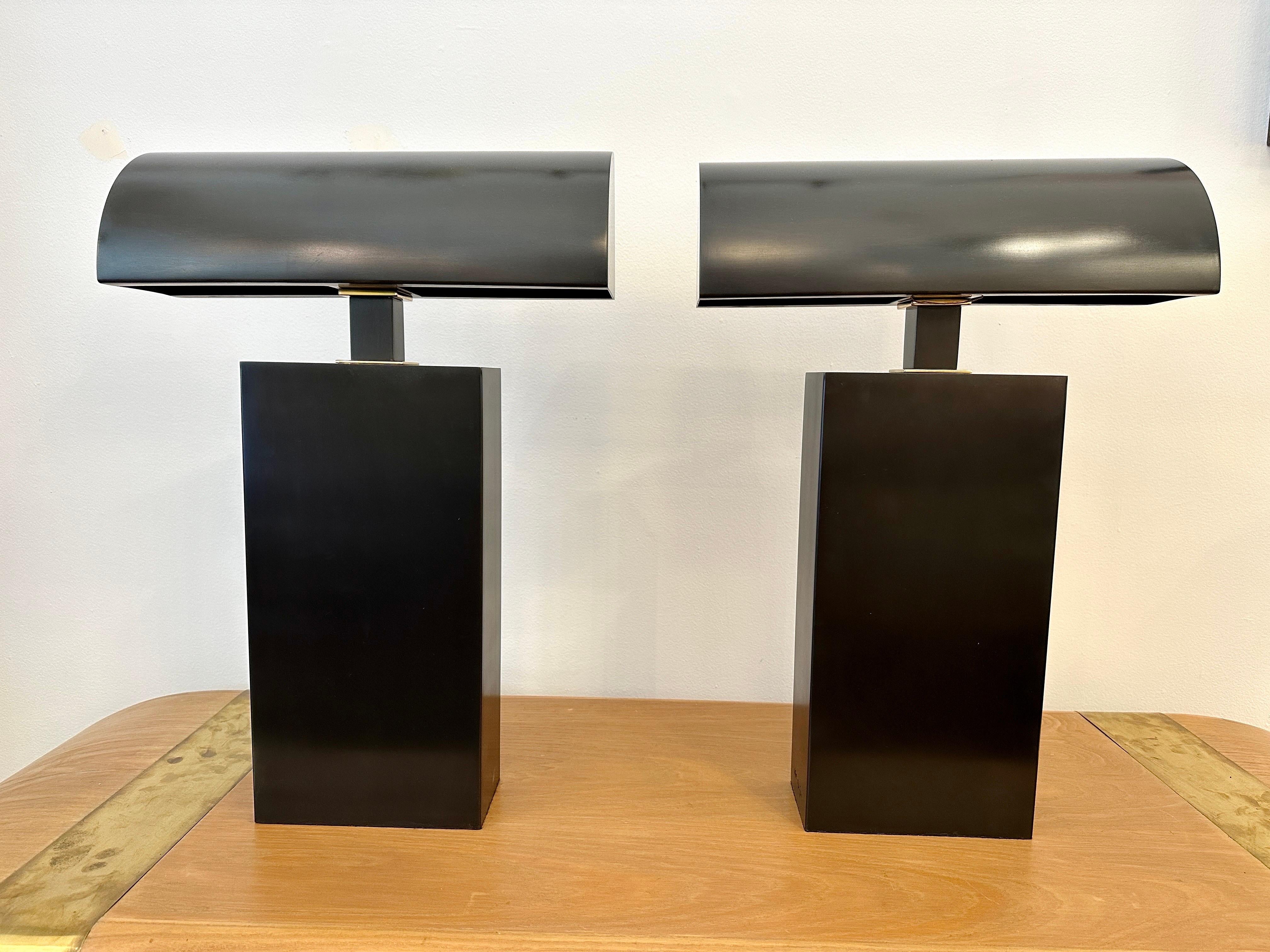 This is a phenomenal pair of SIGNED Karl Springer sculptural, wide and heavy lamps shaped as a rectangular block at the base and as a ninety degree angle semi-tunnel in shade.  Both parts are joined by a solid rectangular block - ALL in a black