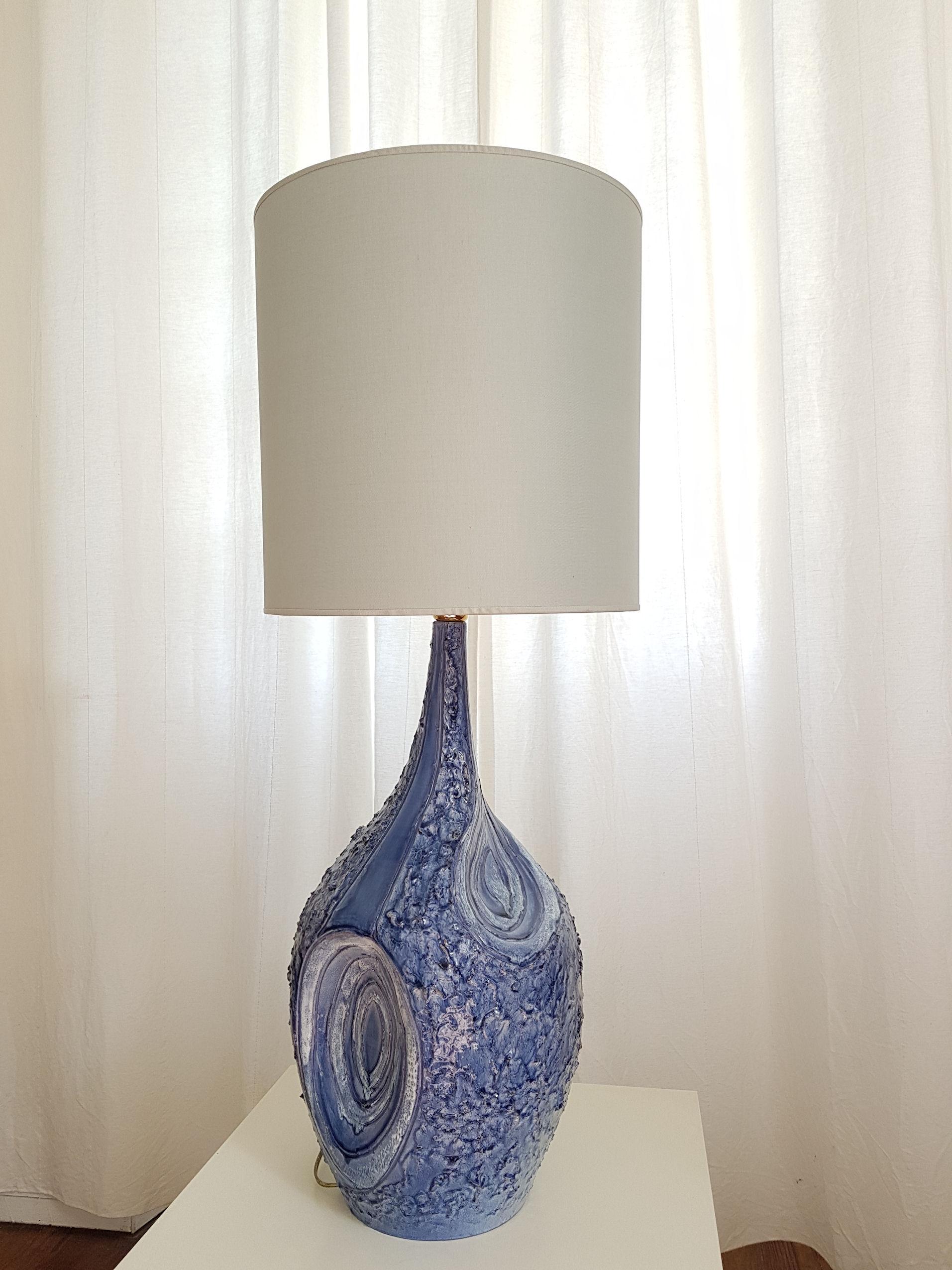 Large handcrafted blue and white ceramic pair of table lamps, signed by the artist, Italy, 1980s.
The Vintage lamps ceramic work is textured, creating an irregular surface, with different hues of blue, and white.
The Mediterranean style lamps have
